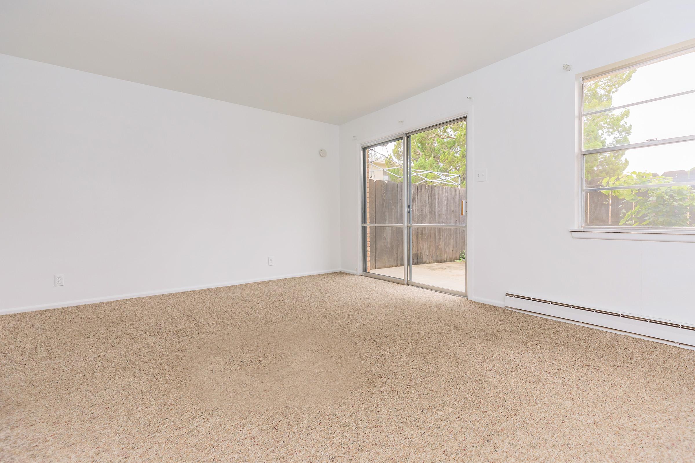 a living room next to a window