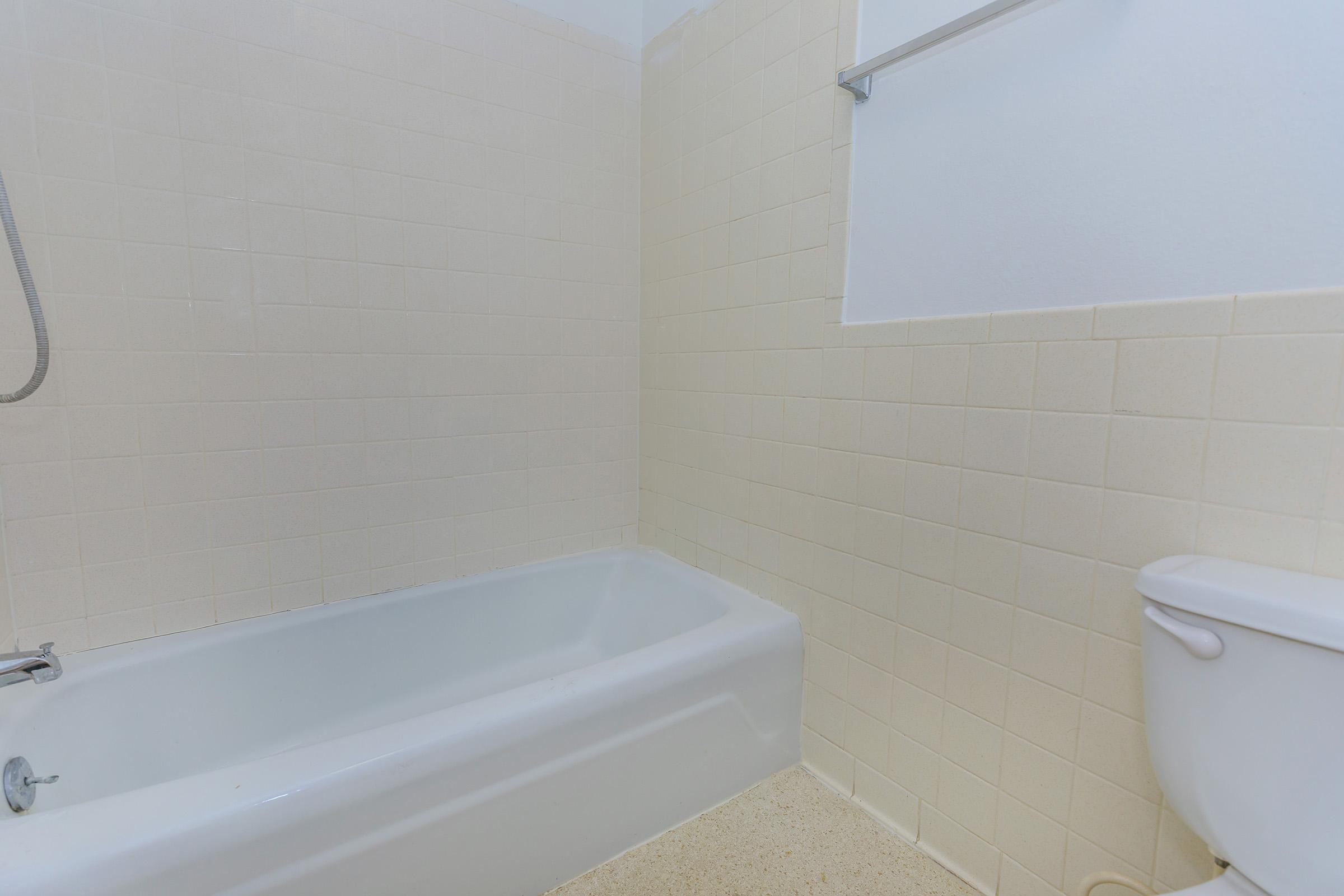 a close up of a sink and a bath tub