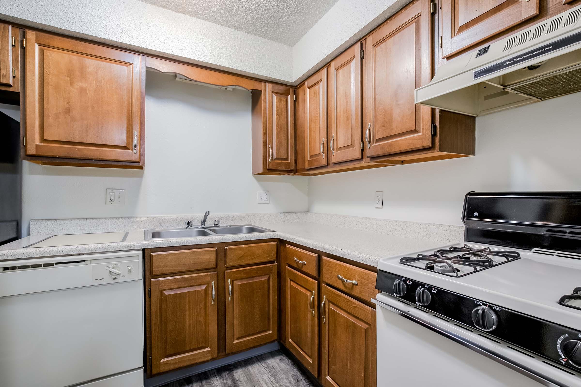 a kitchen with a stove top oven