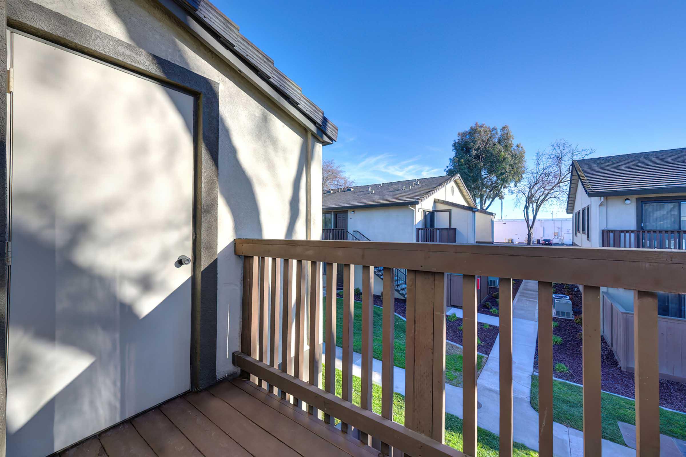 balcony with wood railing