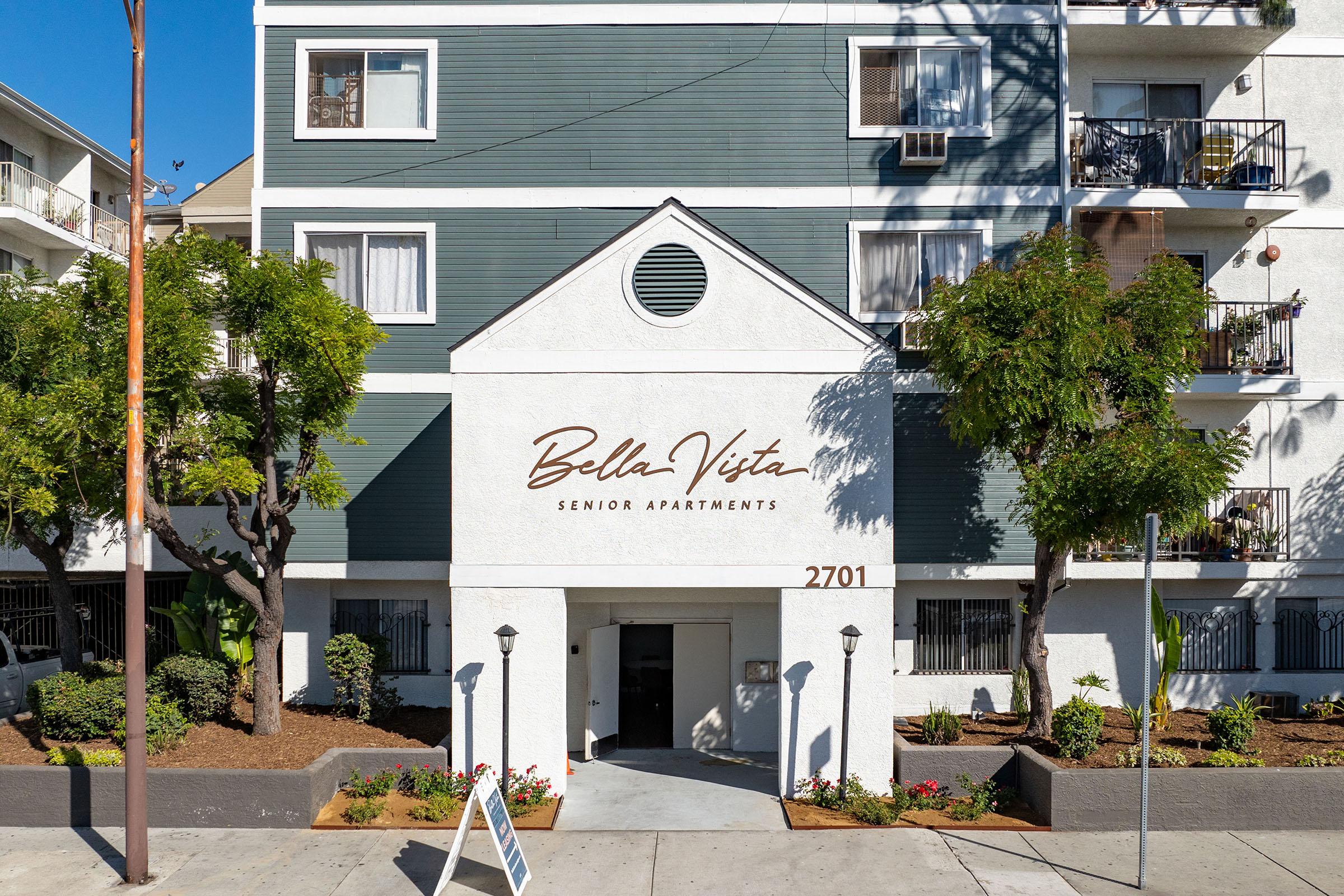 a house that has a sign on the side of a building