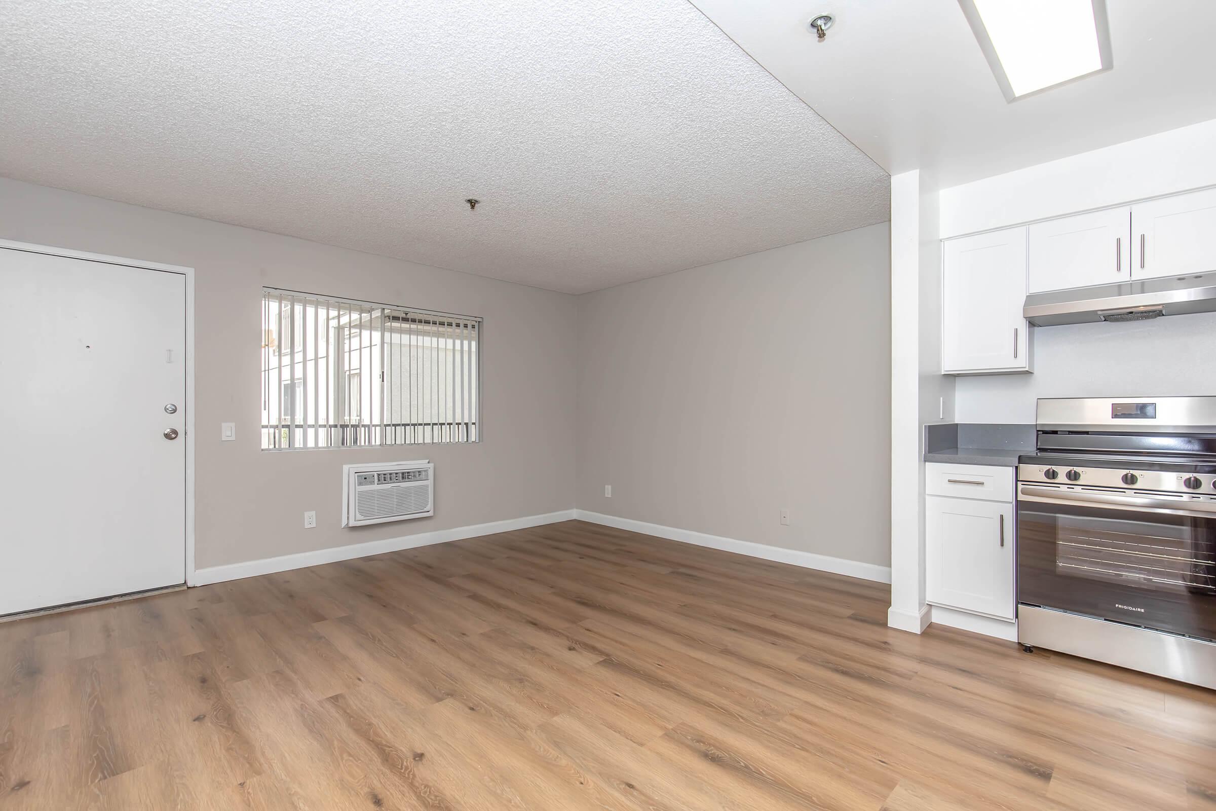 a kitchen with a wood floor