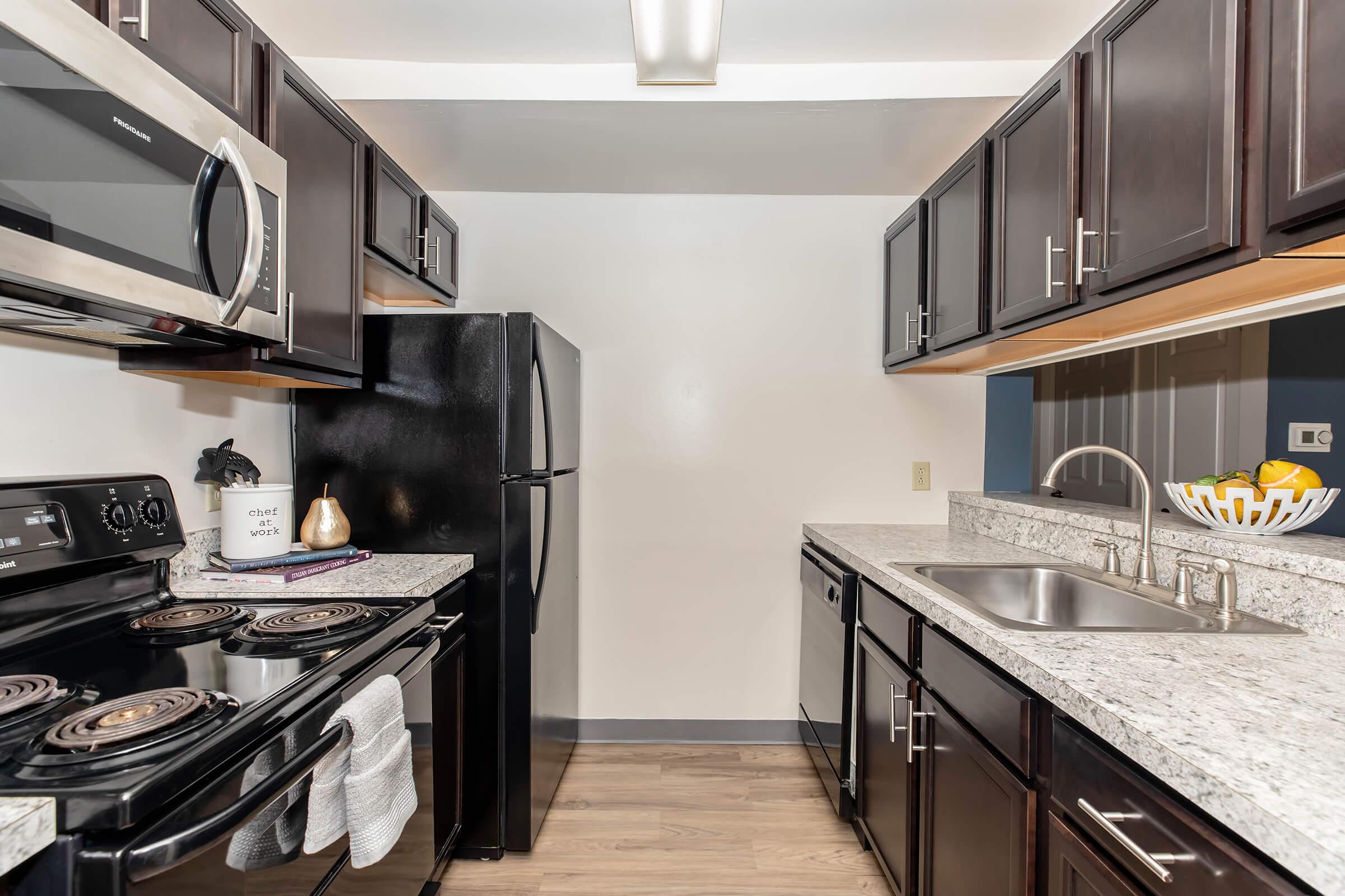 a large kitchen with stainless steel appliances