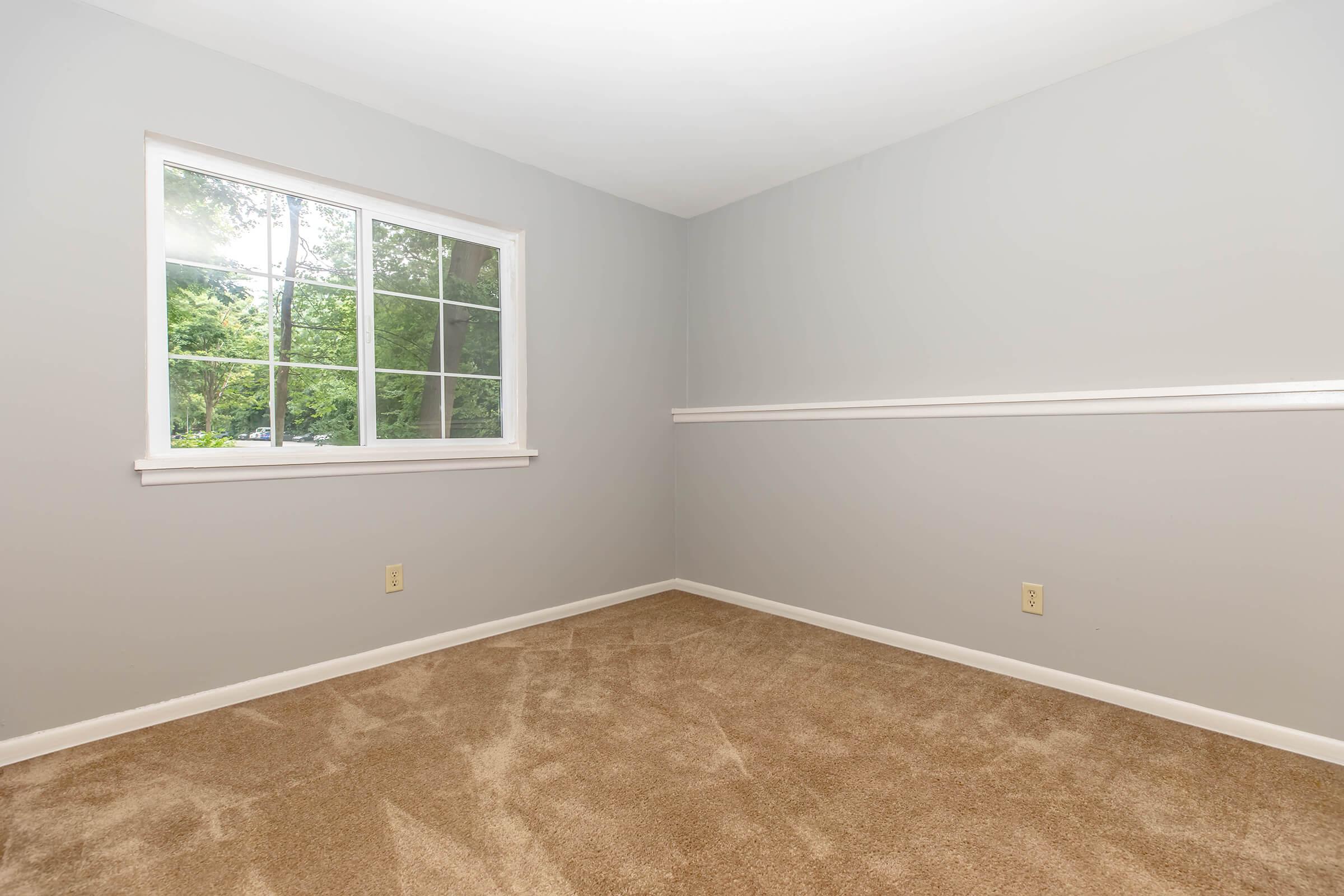 a bedroom with a large window