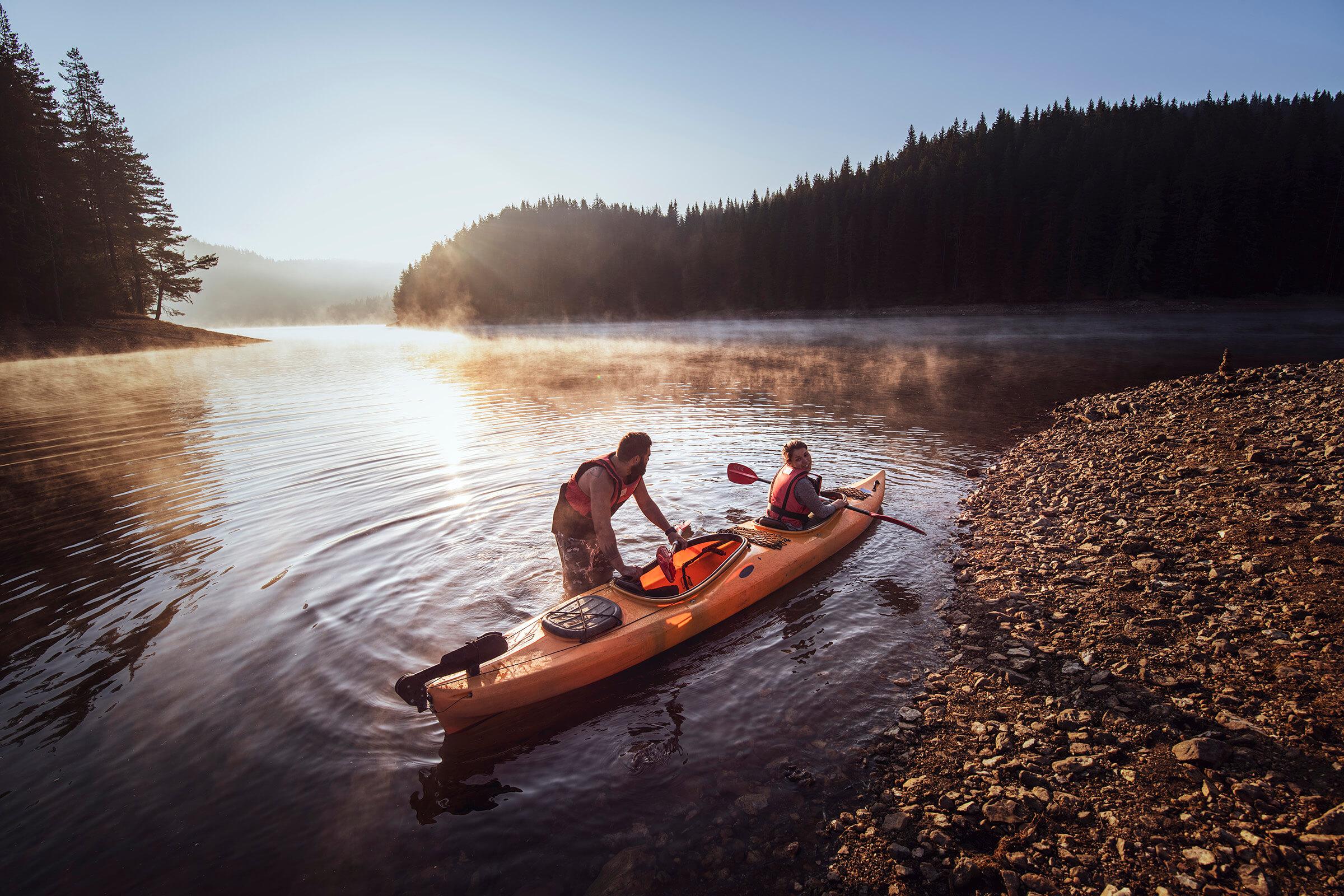 a group of people on a boat in the water
