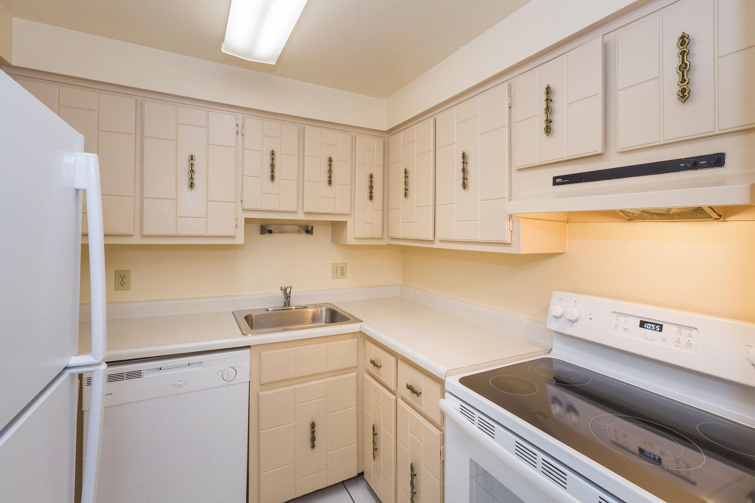 a kitchen with a stove top oven sitting inside of a refrigerator
