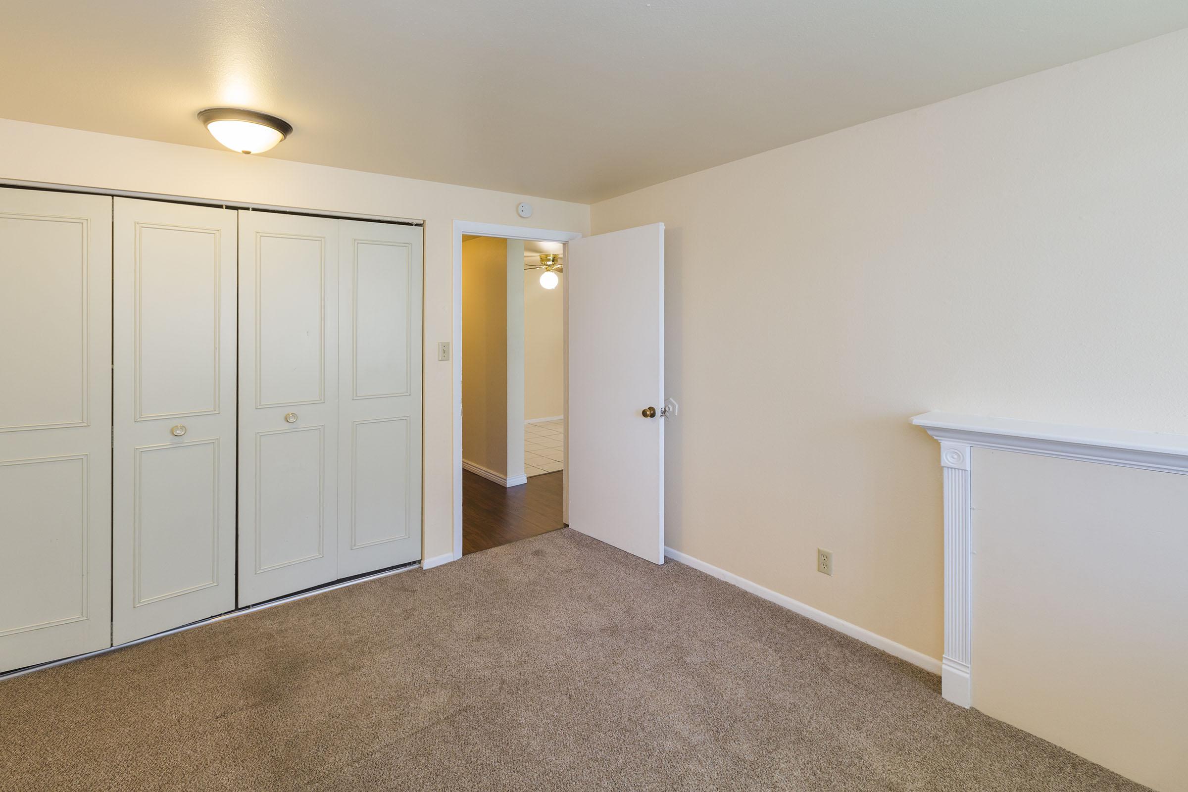 a bedroom with a bed in a room