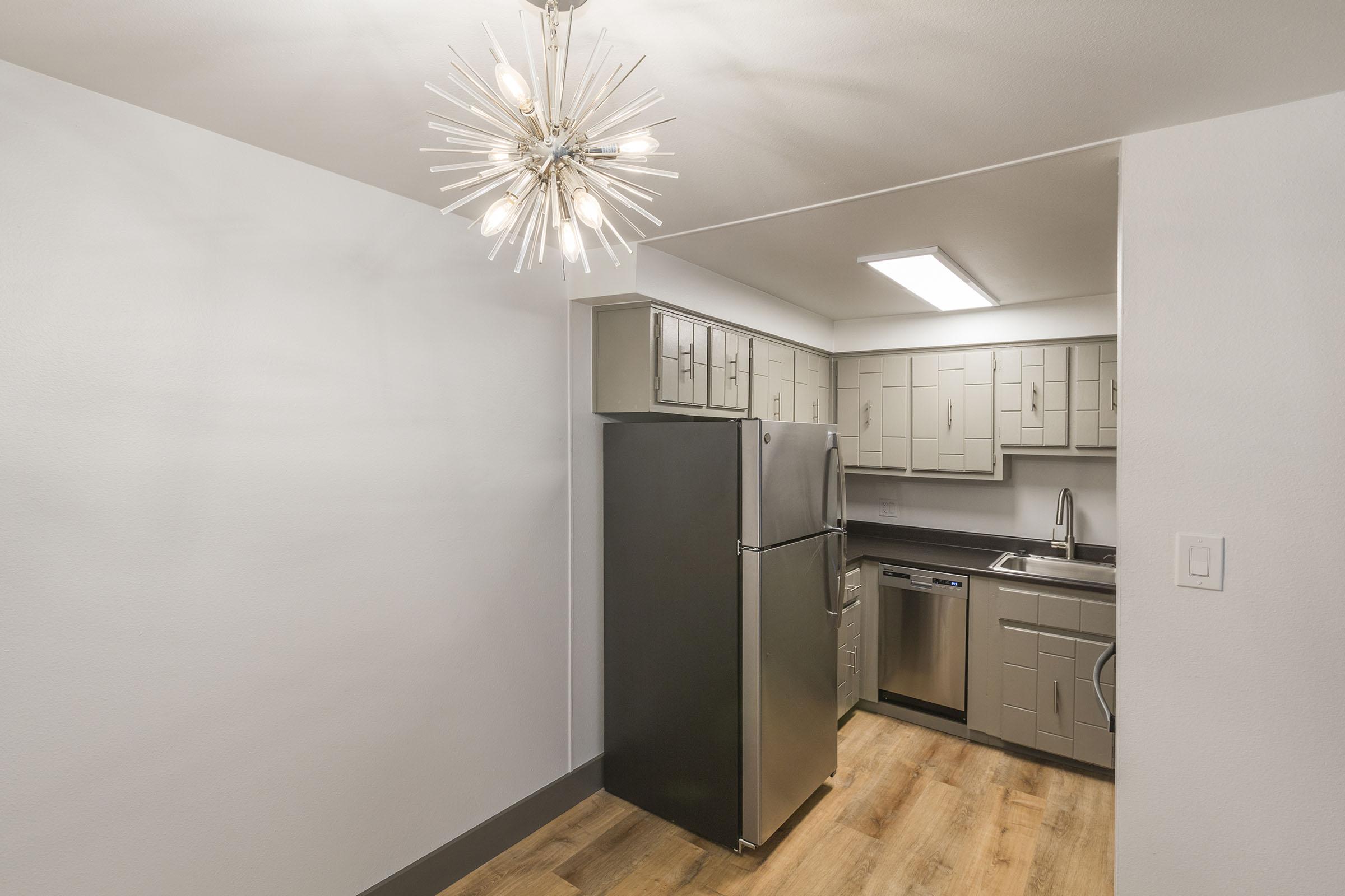 a stainless steel refrigerator in a kitchen