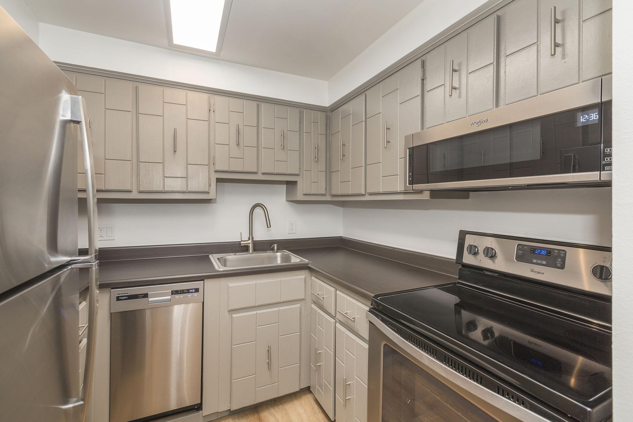 a kitchen with stainless steel appliances