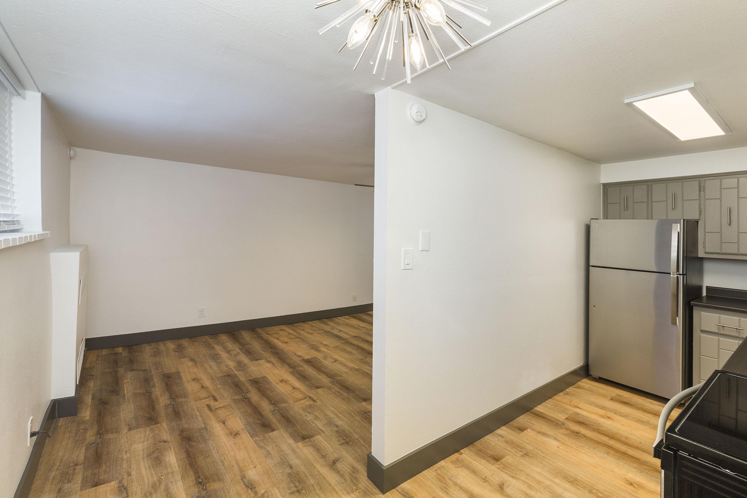 a kitchen with a wood floor