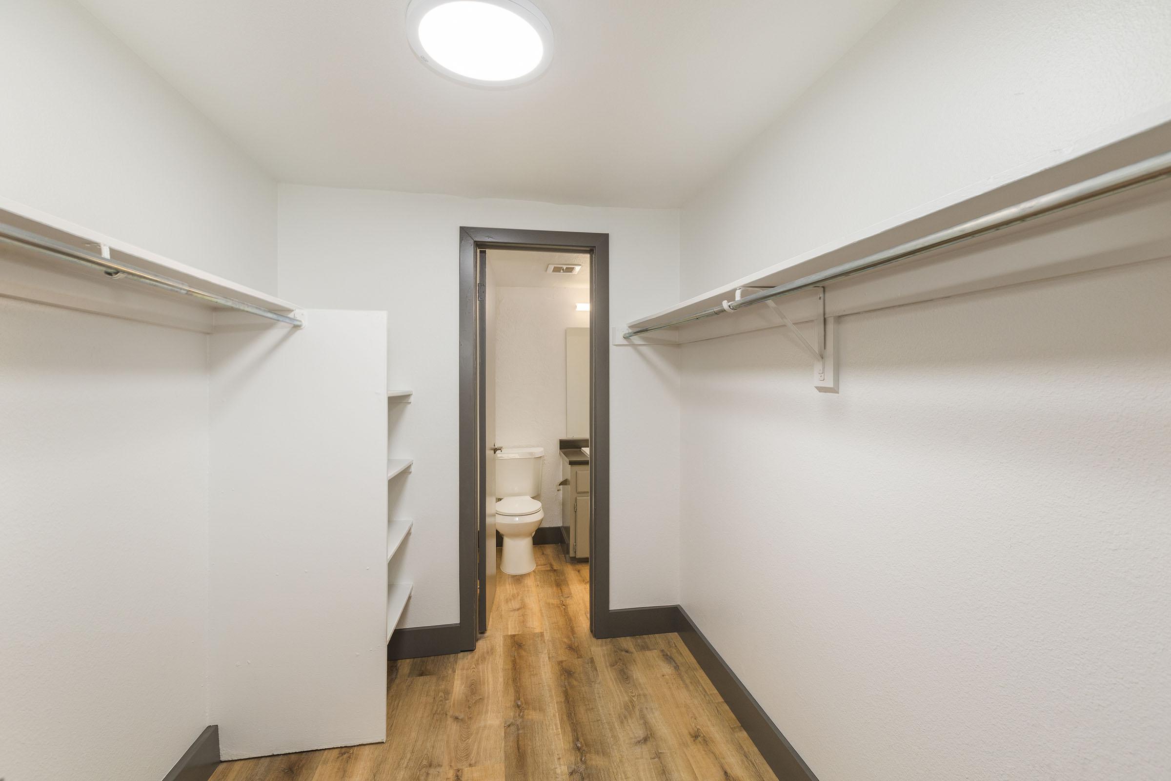 a room with a sink and a mirror
