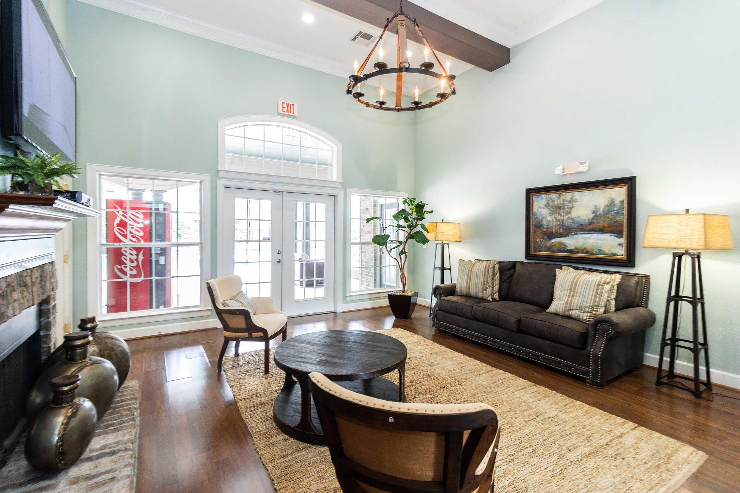 a living room filled with furniture and a fire place