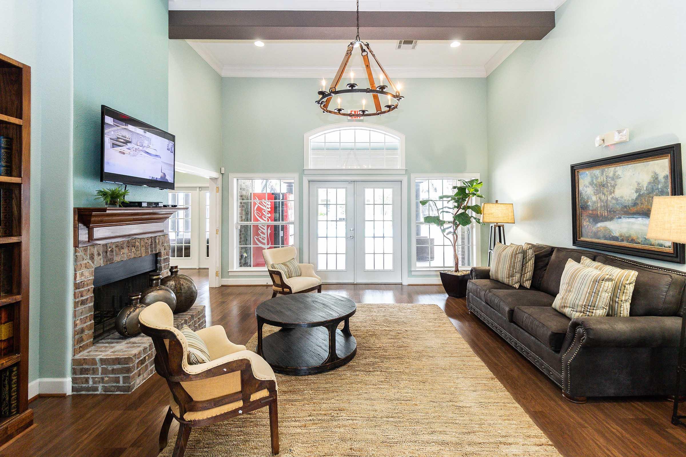 a living room filled with furniture and a fireplace