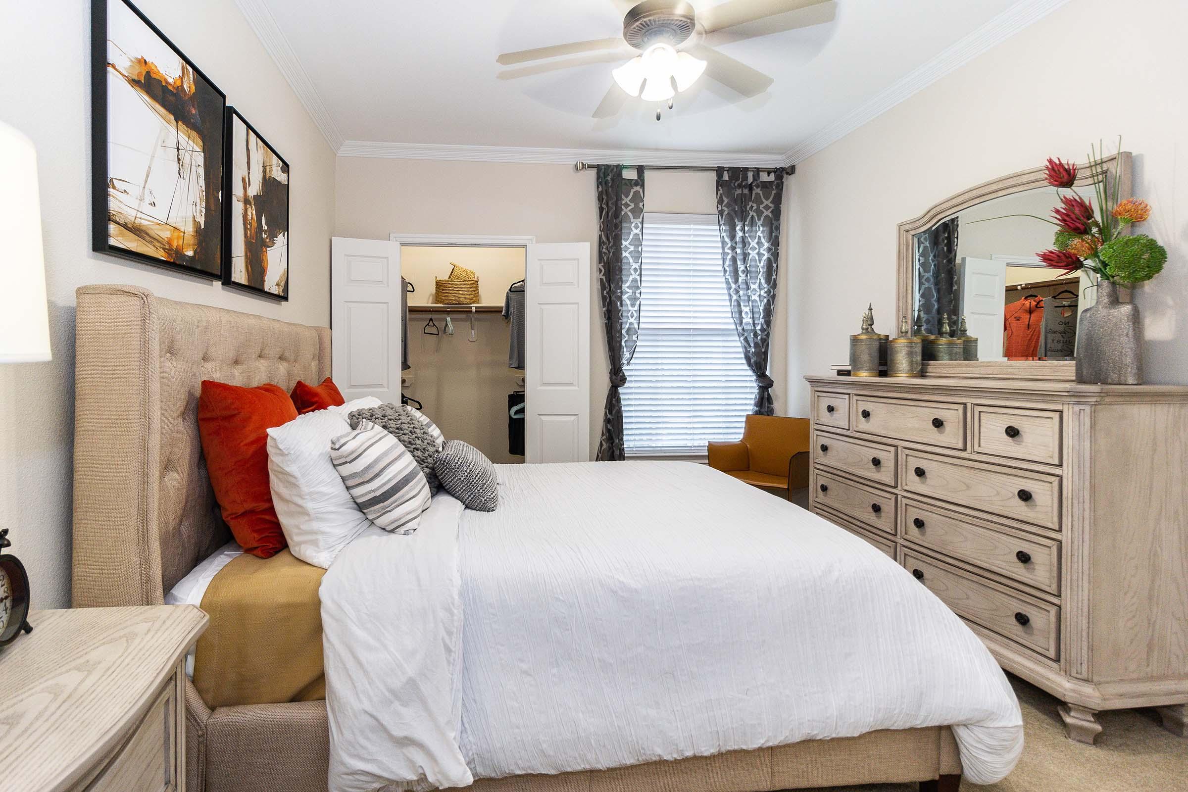 a bedroom with a large bed in a room