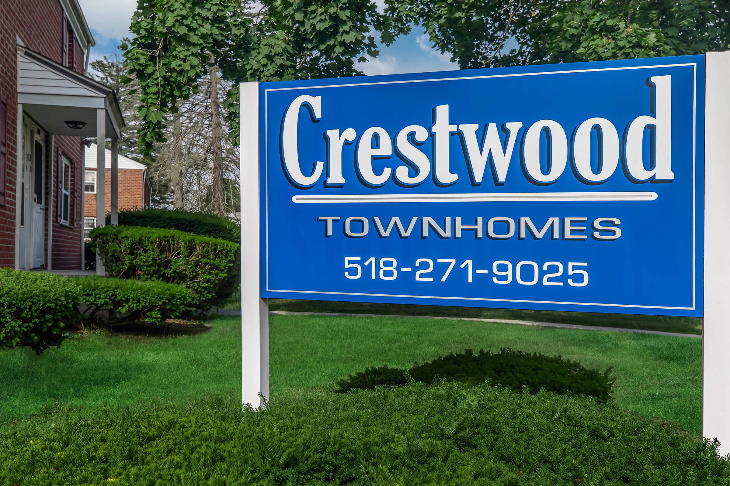 a sign in front of a house