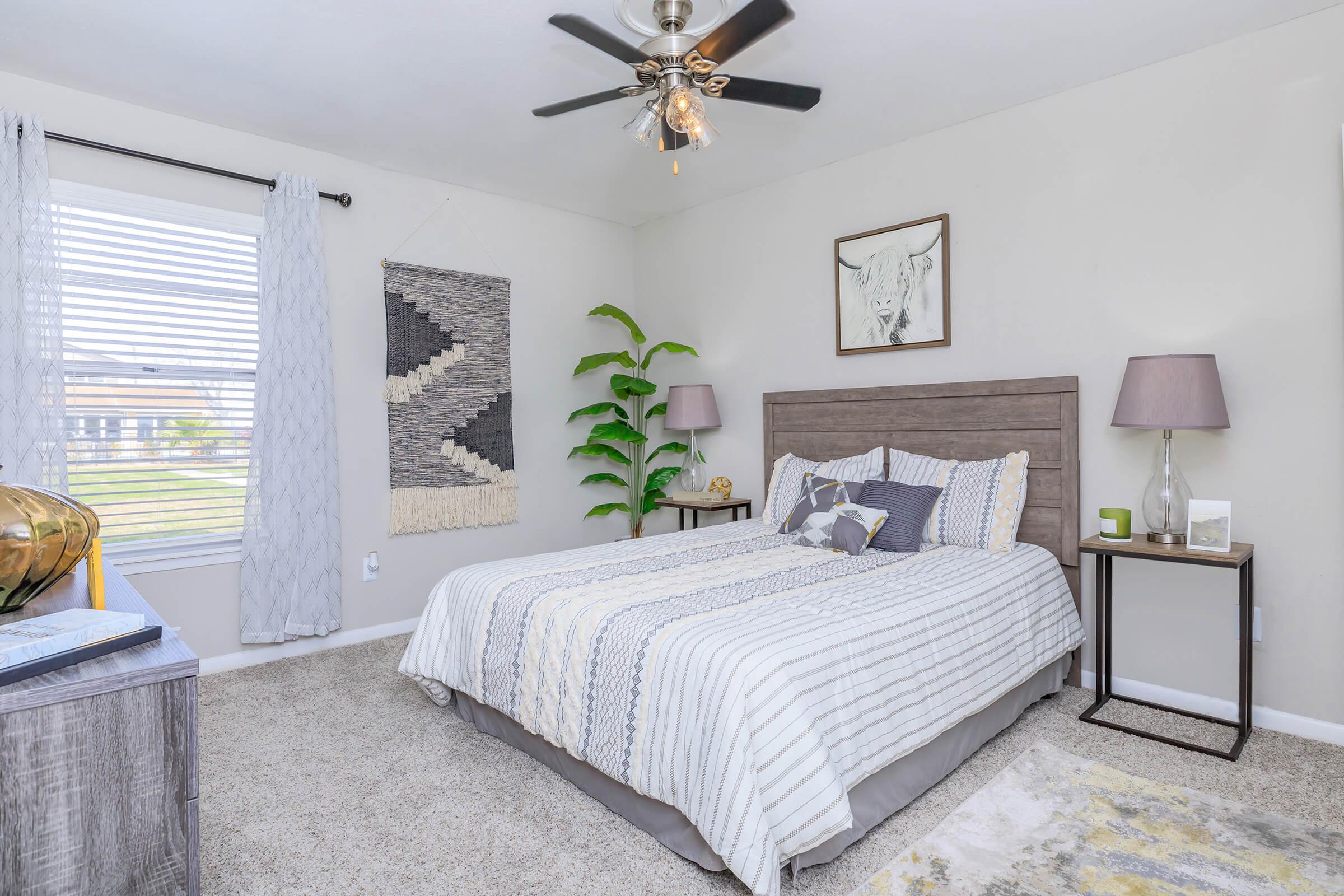 a bedroom with a large bed in a room