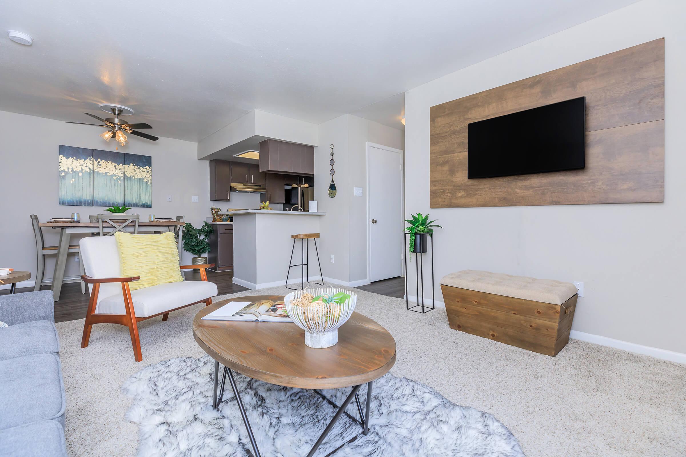 a living room filled with furniture and a fireplace