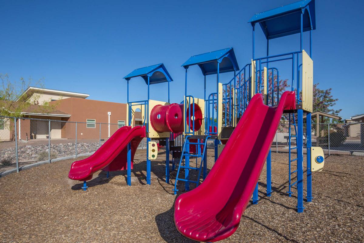 a group of lawn chairs sitting on top of a playground