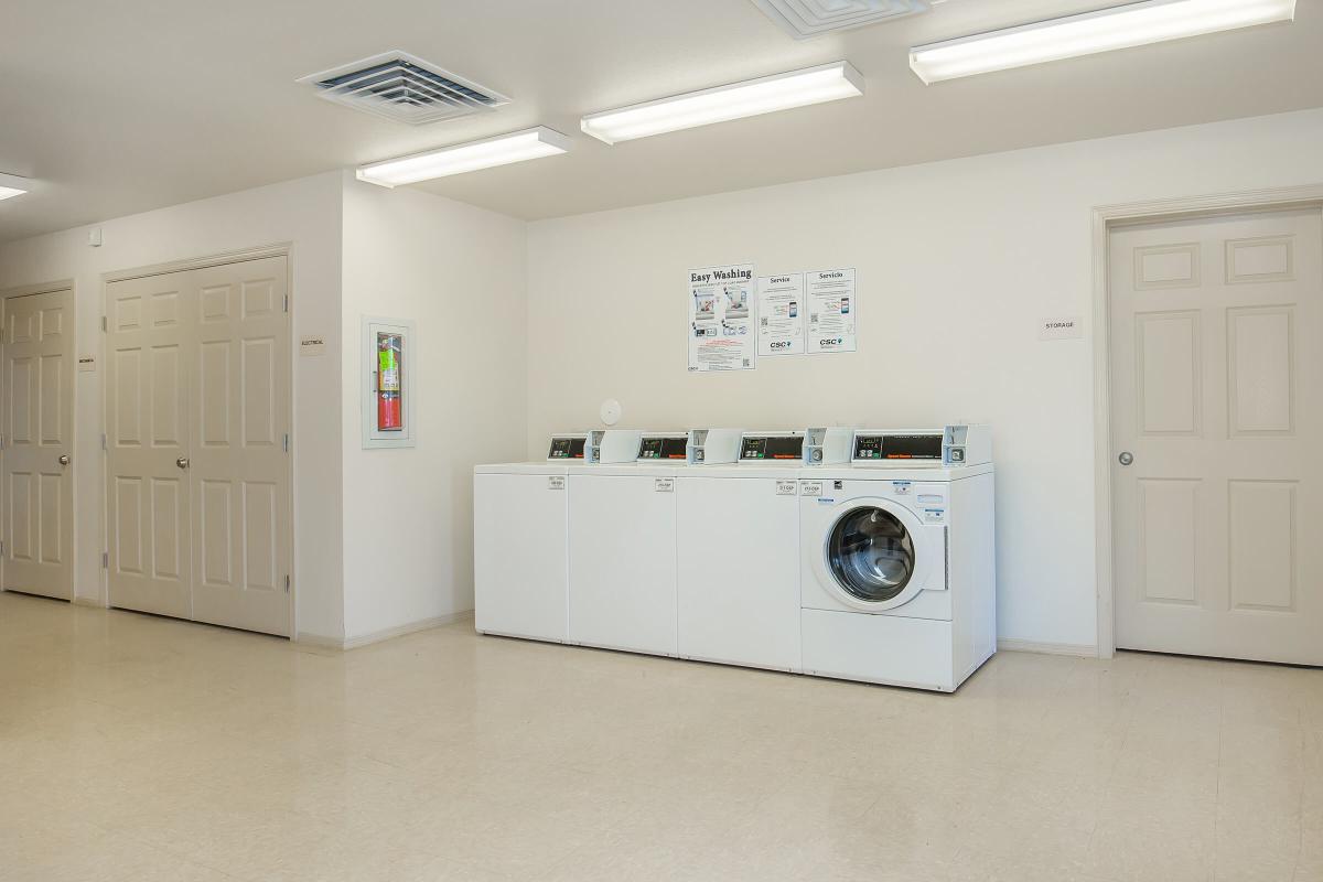 a white refrigerator freezer sitting inside of a kitchen