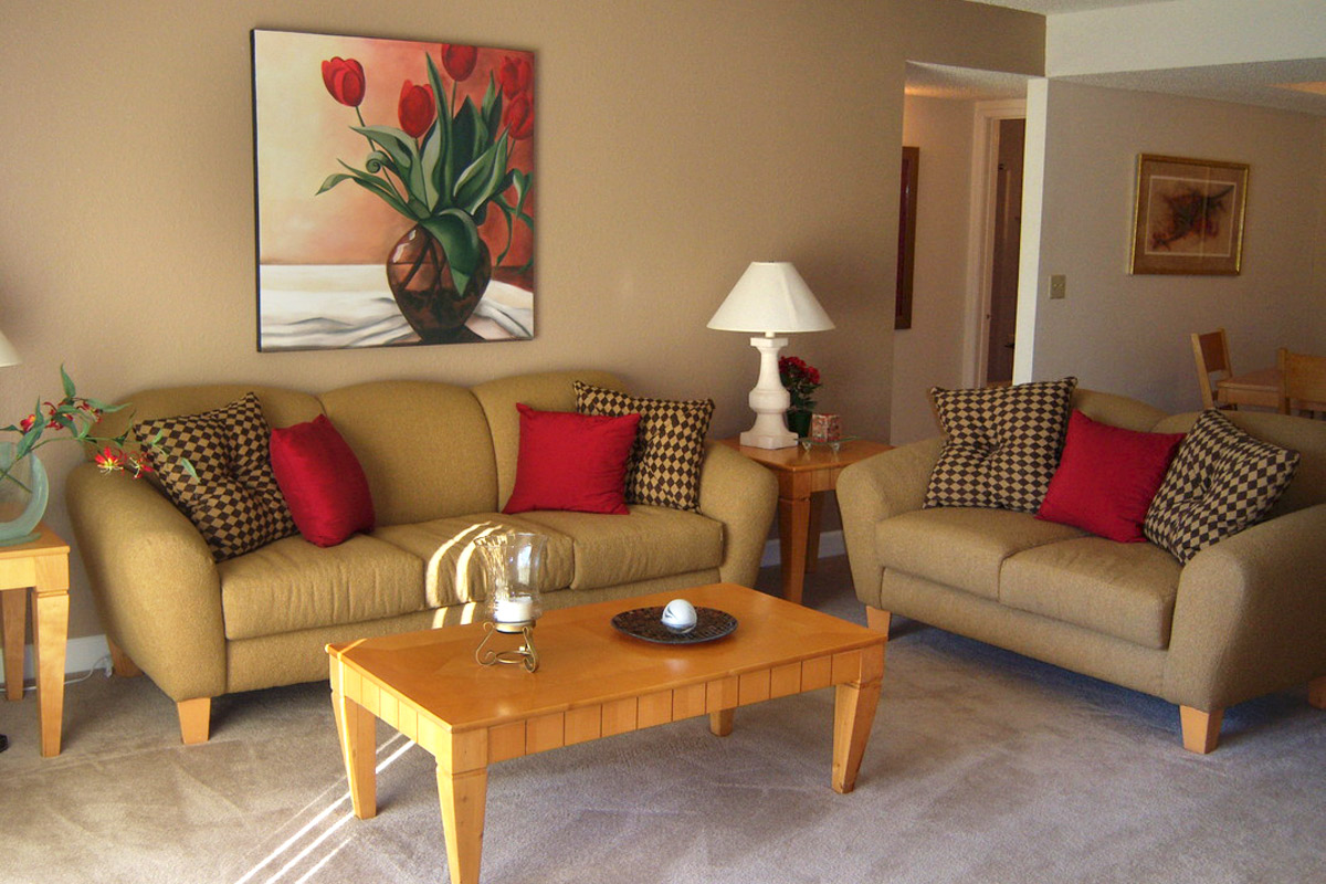 a living room with a couch a table and chairs