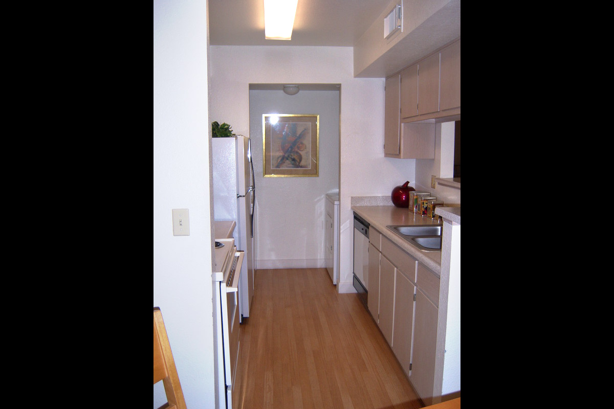 a white refrigerator freezer sitting inside of a kitchen