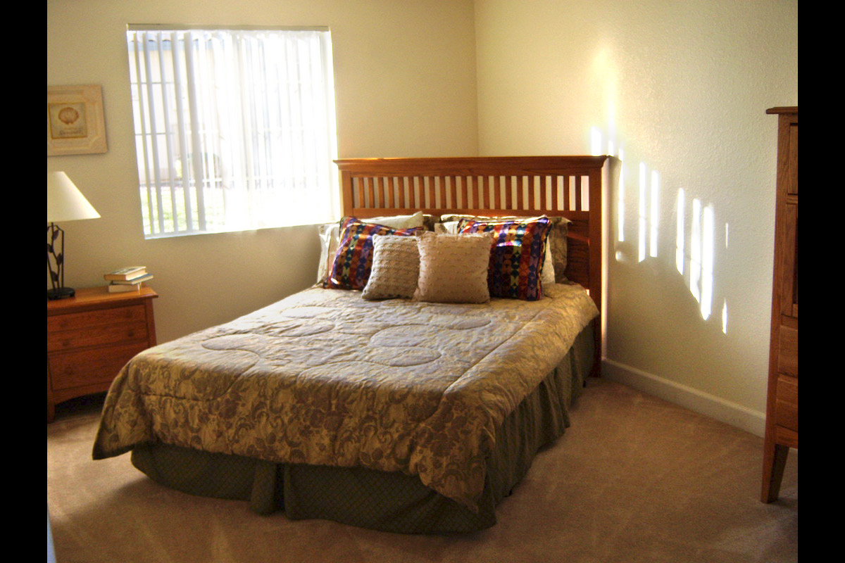 a bedroom with a bed in a hotel room