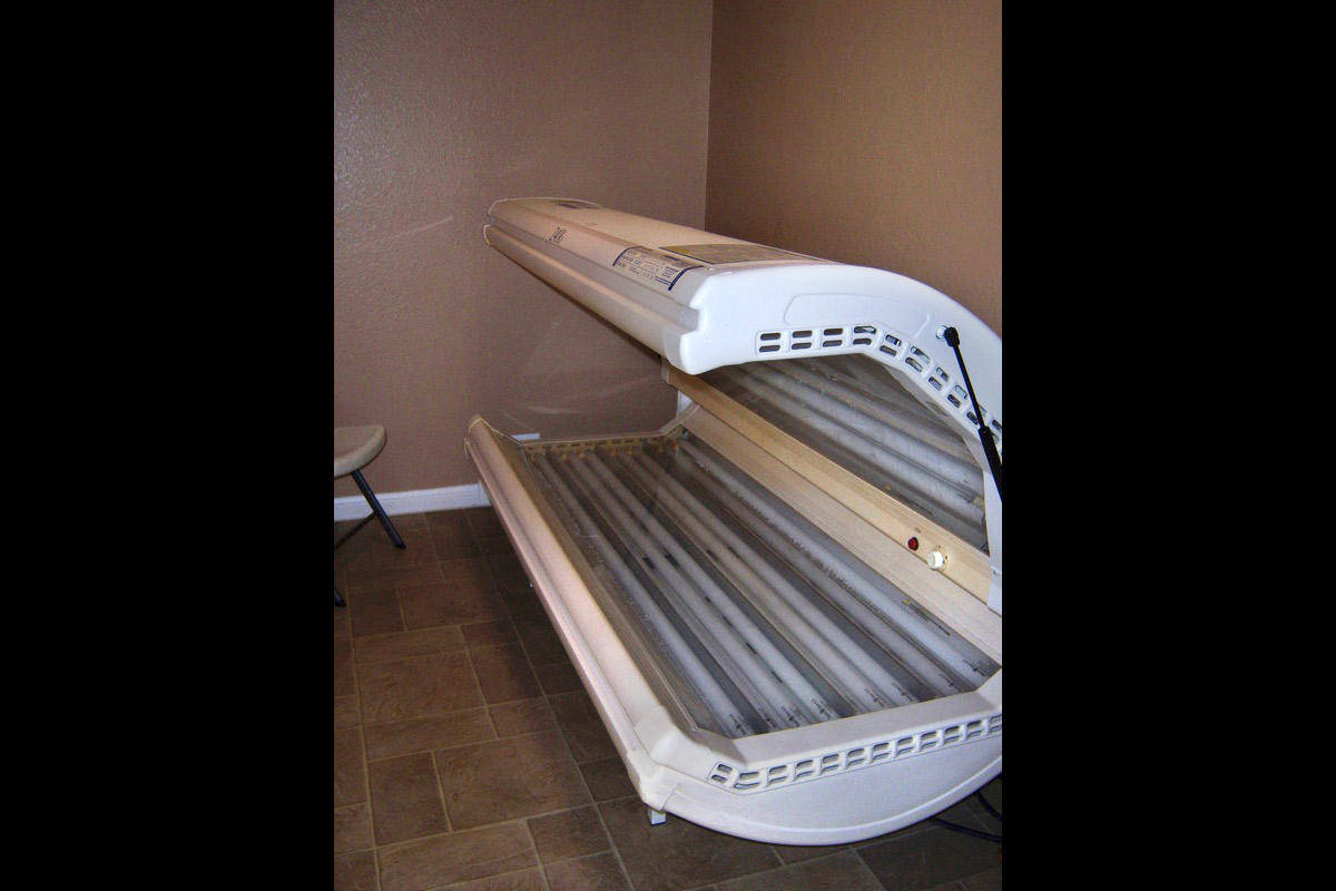 a bed in a dark room