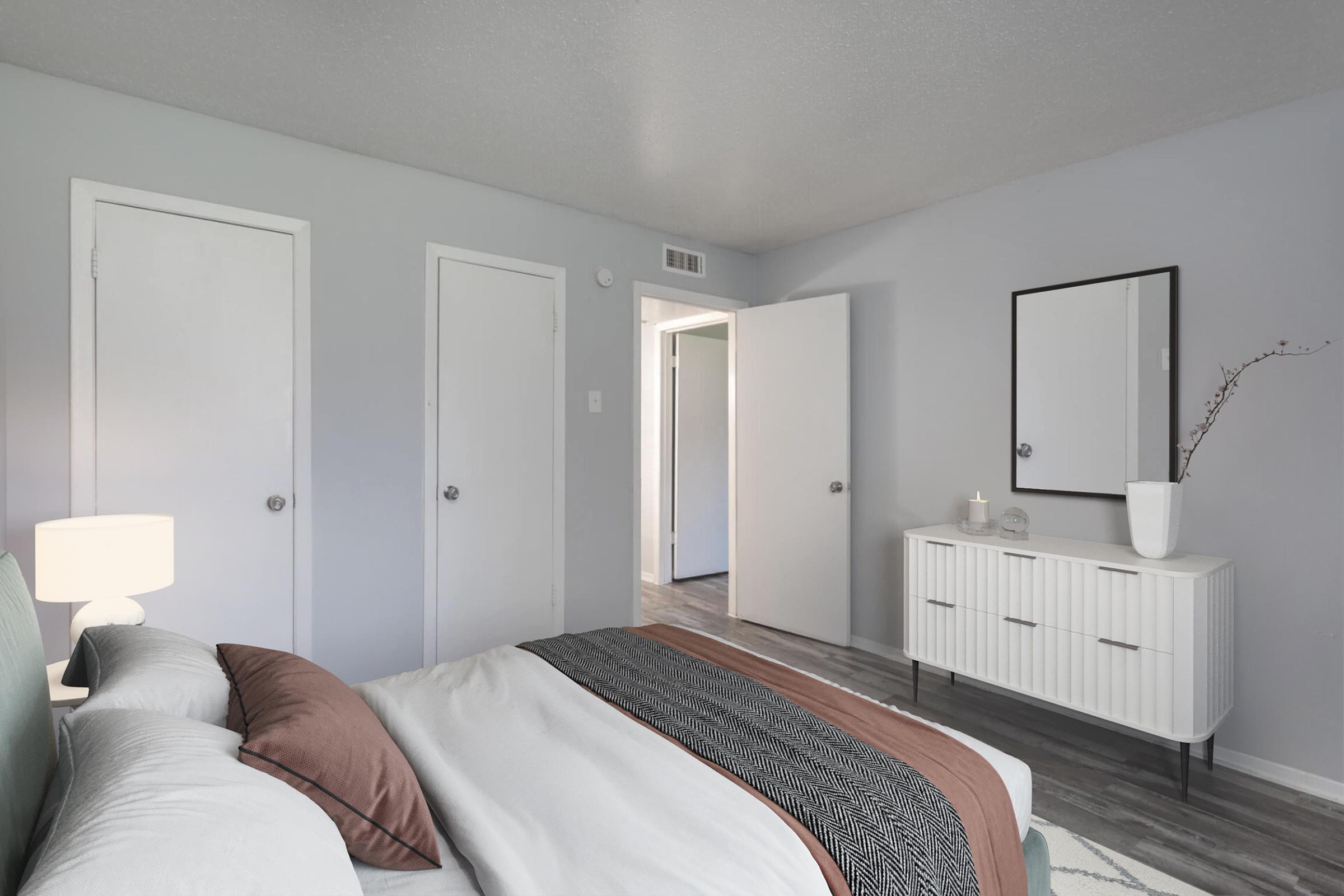 a bedroom with a large bed in a hotel room