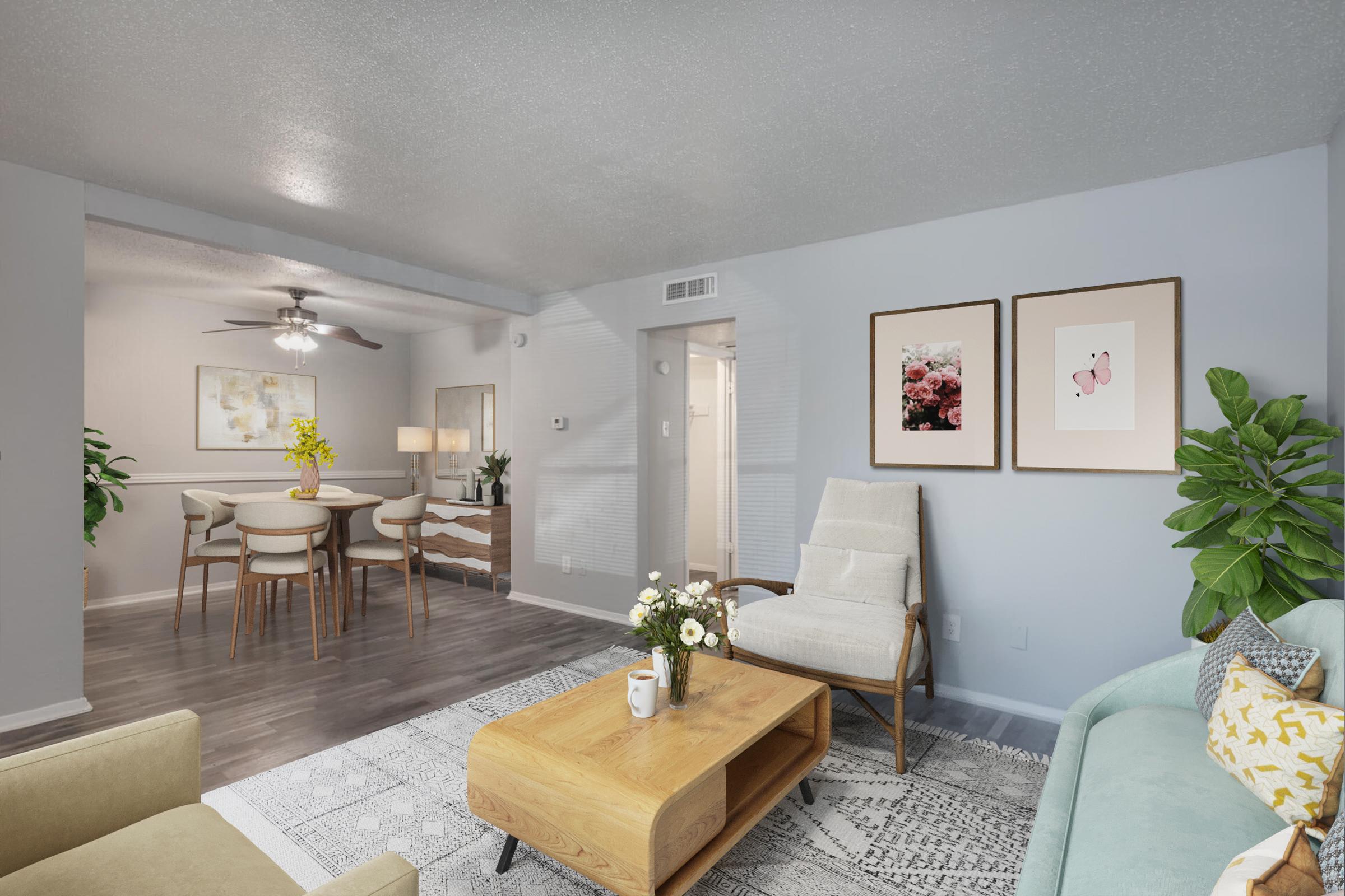 a living room filled with furniture and a table