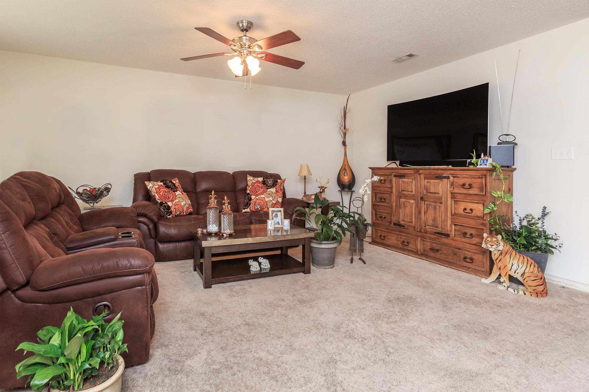 a living room filled with furniture and a fire place