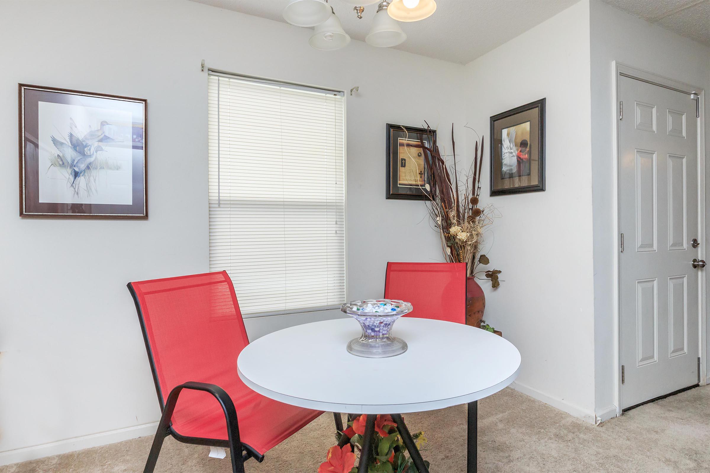 a large red chair in a room