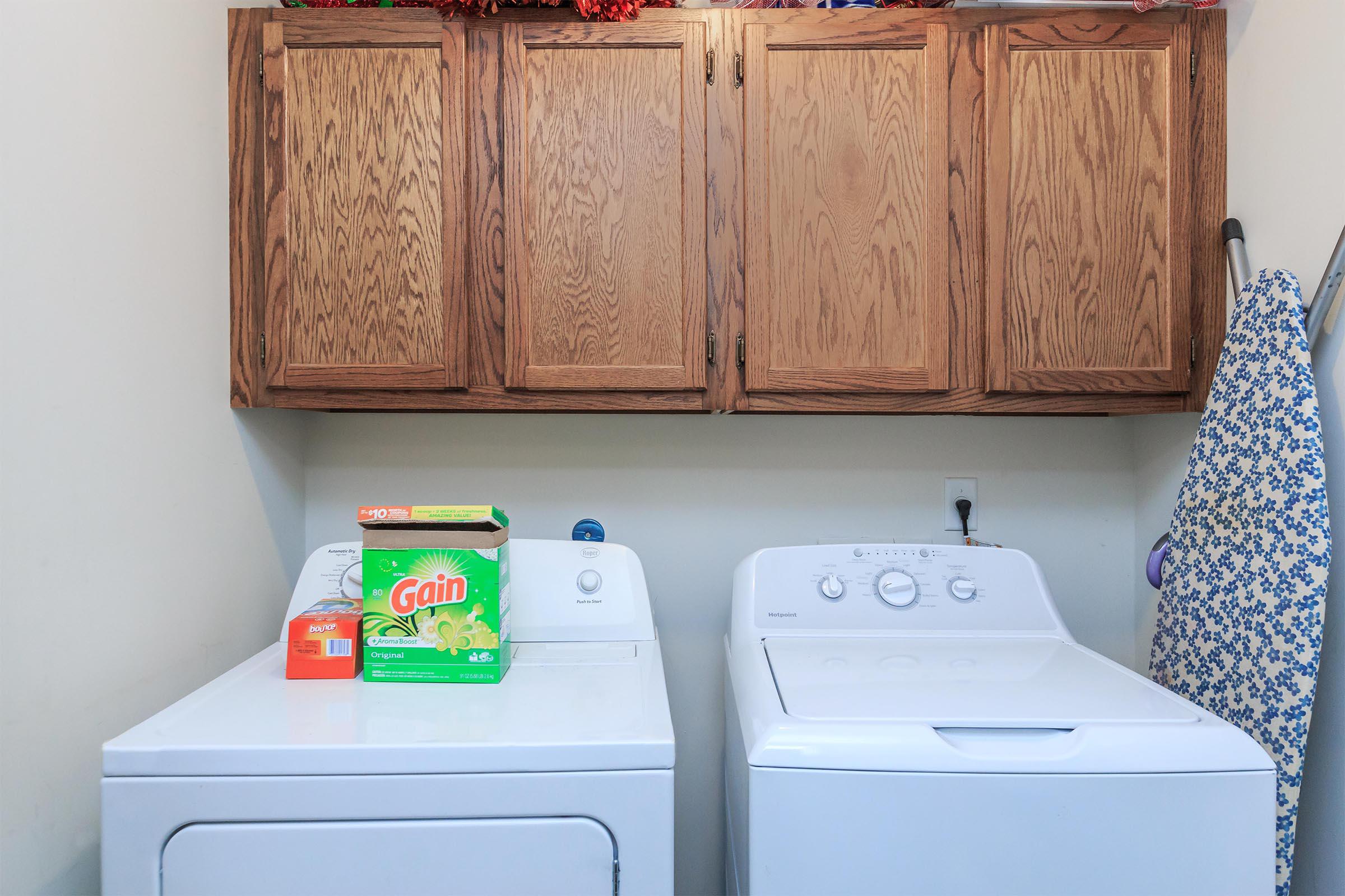 a white refrigerator freezer sitting inside of a kitchen