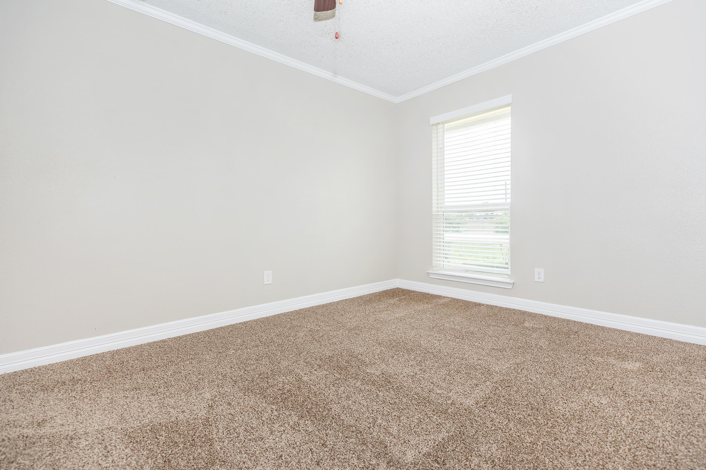 a view of a bedroom next to a window