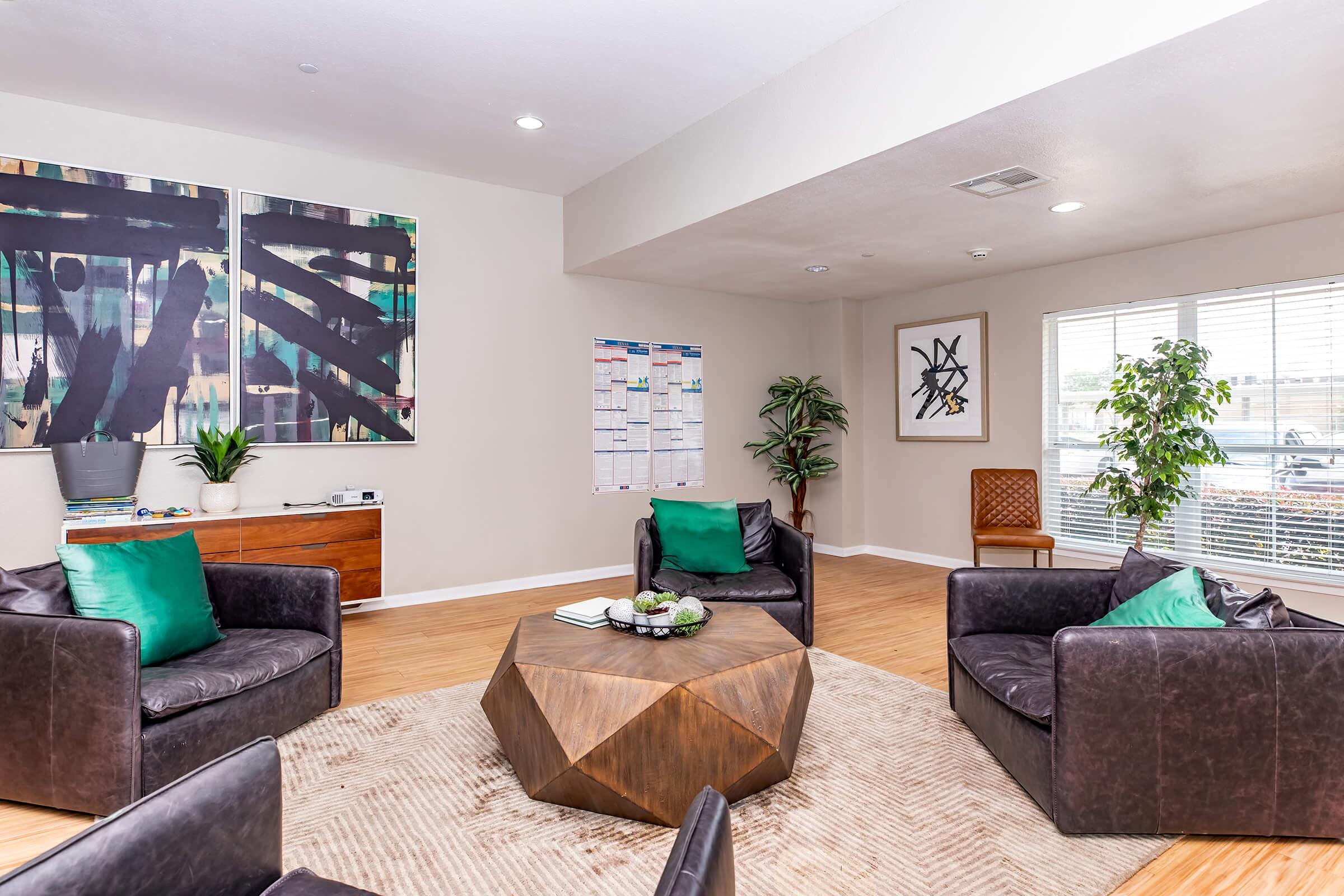 a living room filled with furniture and a flat screen tv