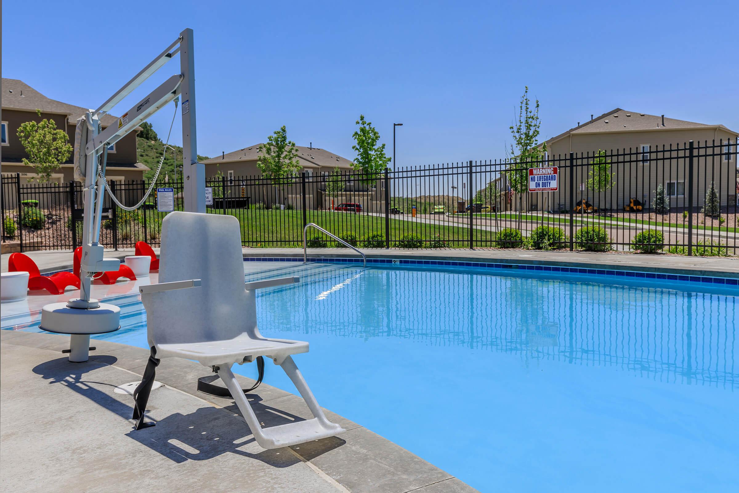 a pool next to a fence