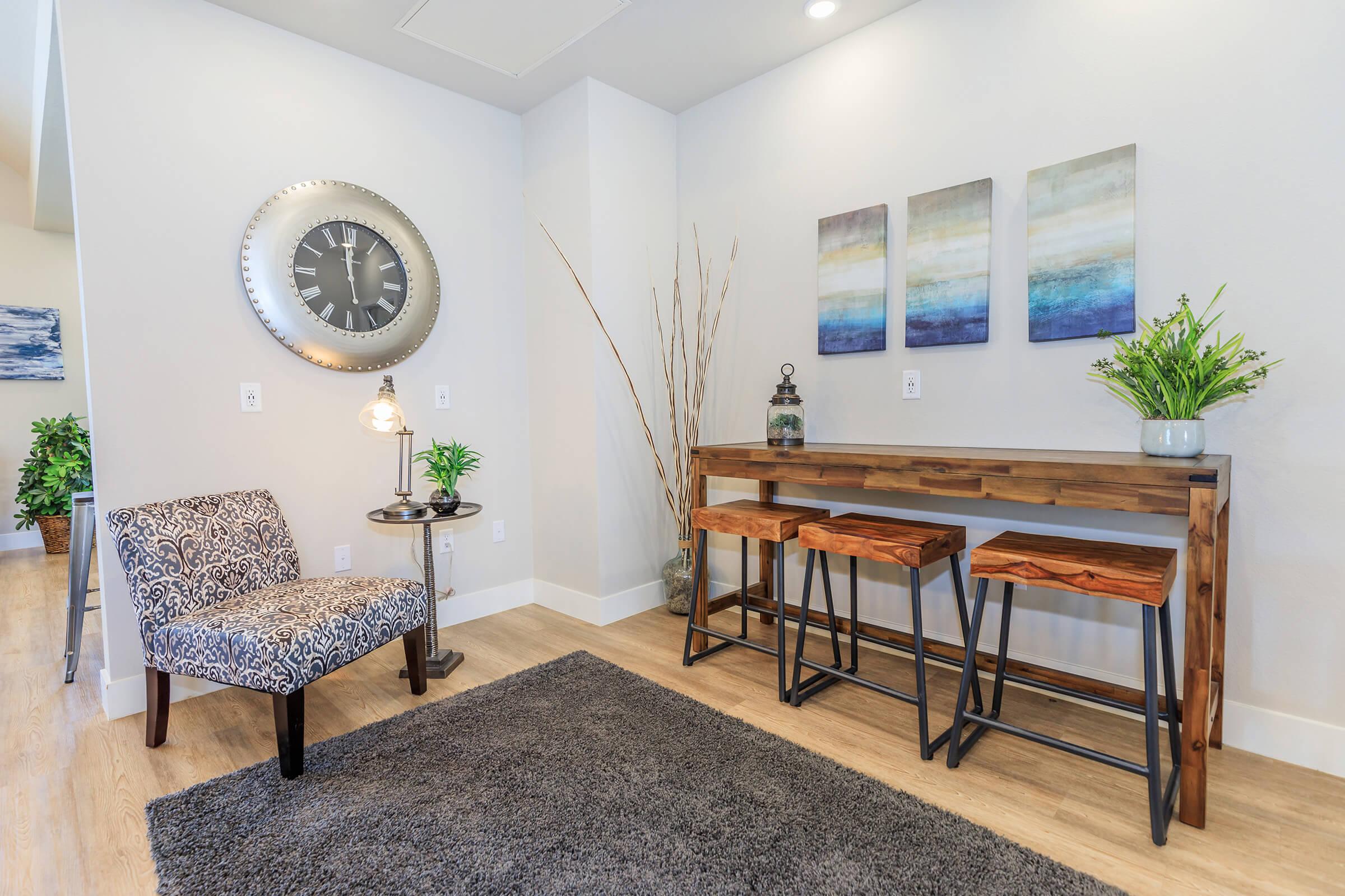 a living room filled with furniture and a large window