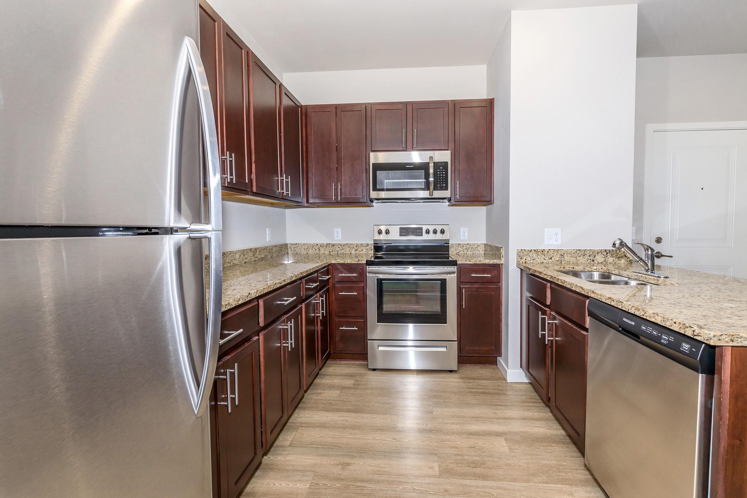 a stainless steel refrigerator in a kitchen