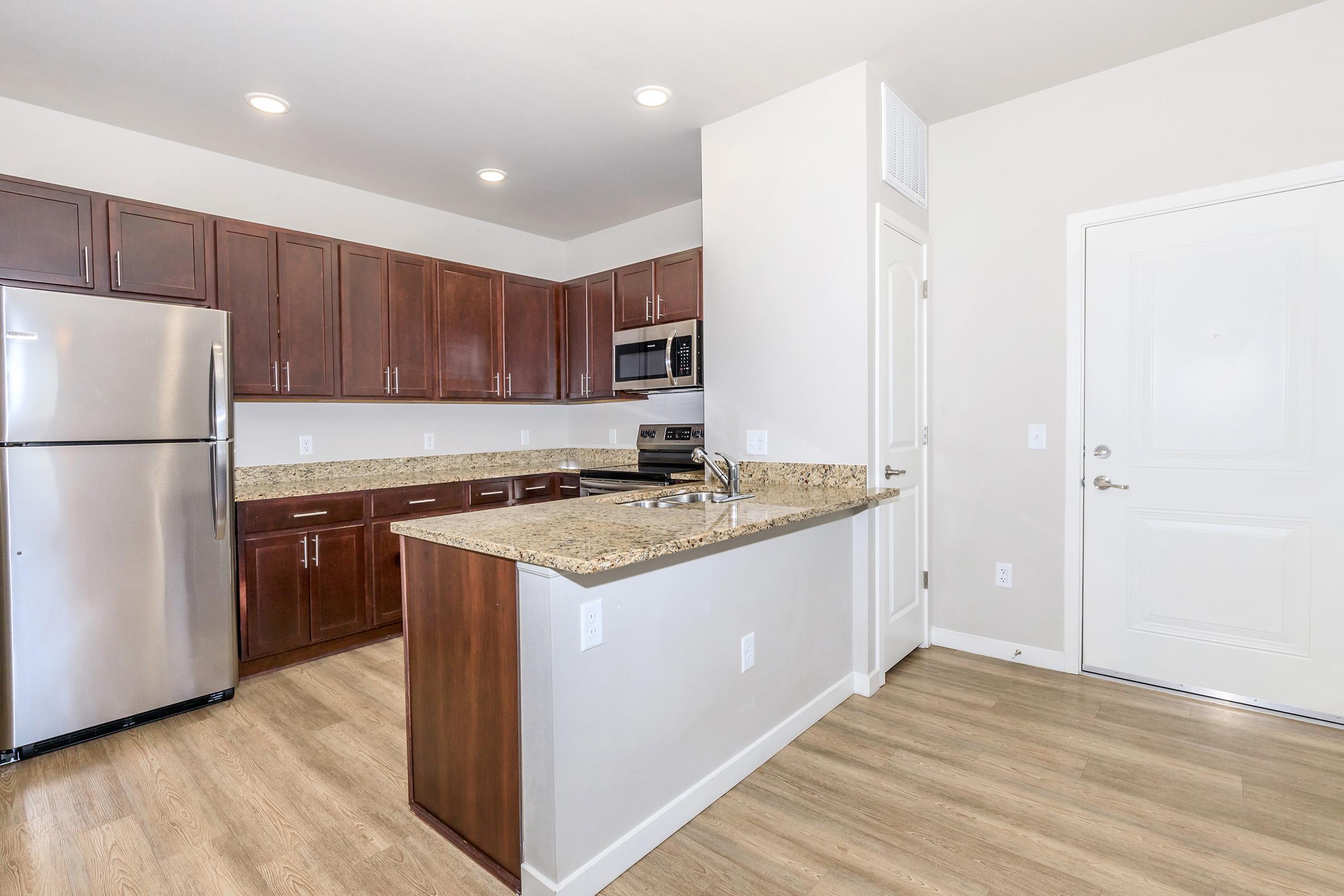 a kitchen with a wood floor