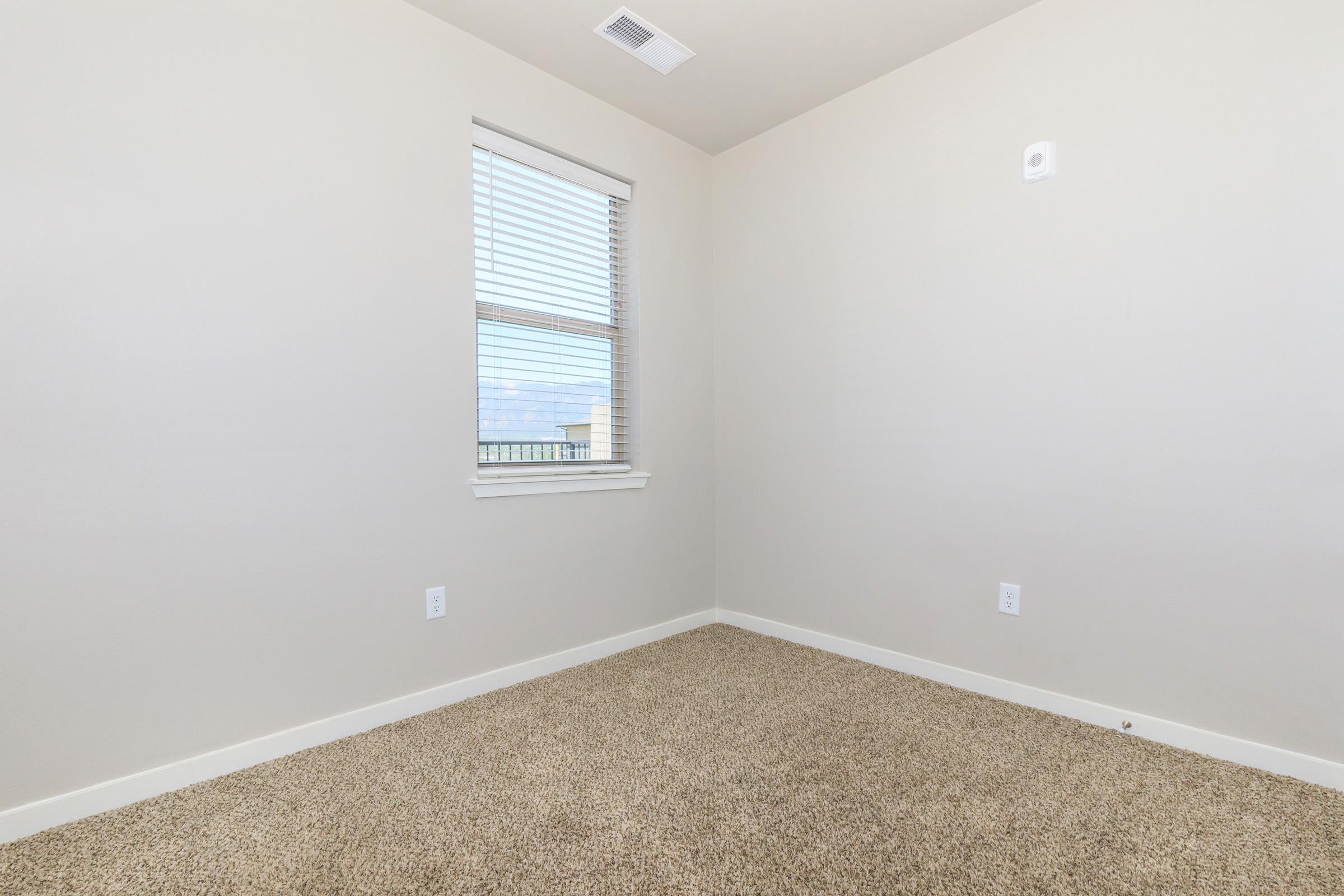 a bedroom with a large mirror