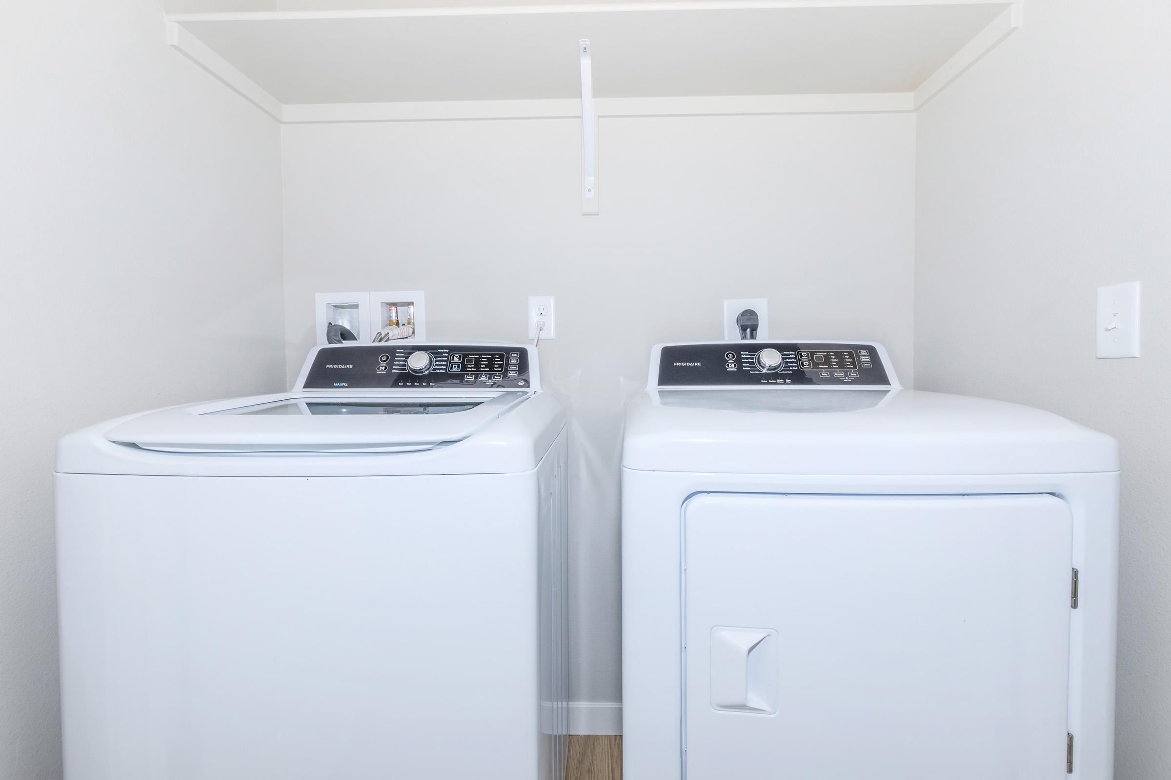 a microwave oven sitting on top of a refrigerator