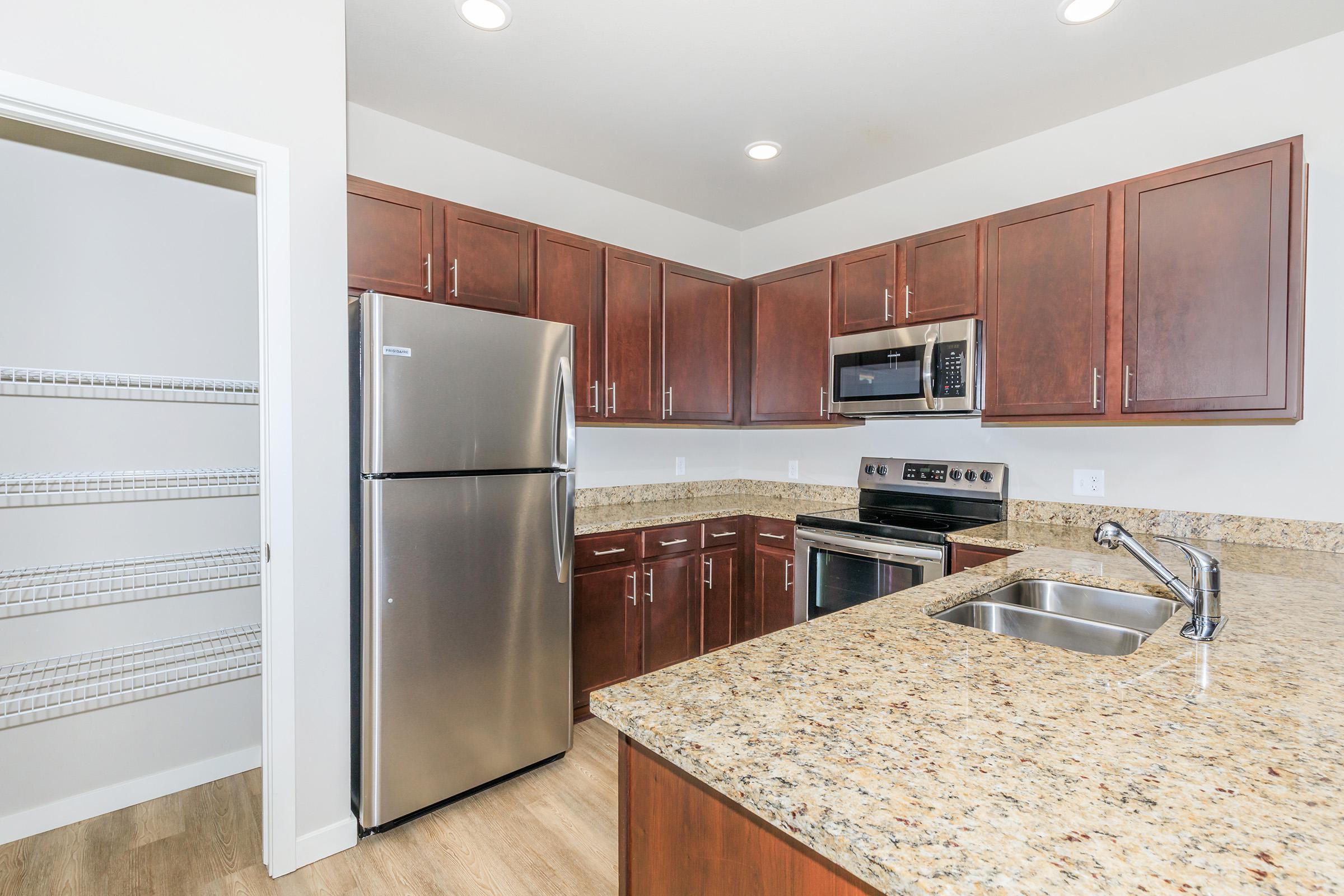 a stainless steel refrigerator in a kitchen