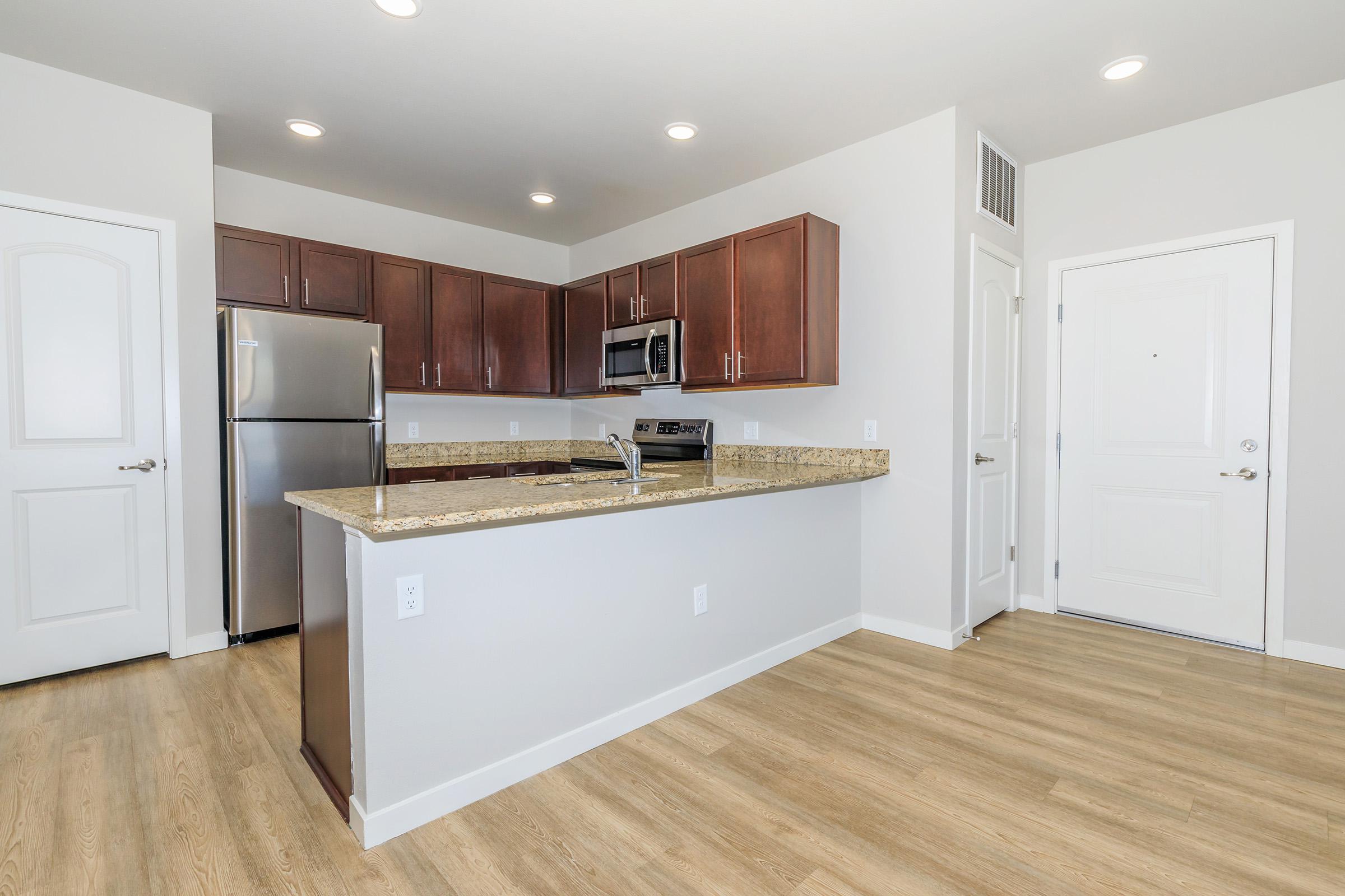 a kitchen with a wood floor