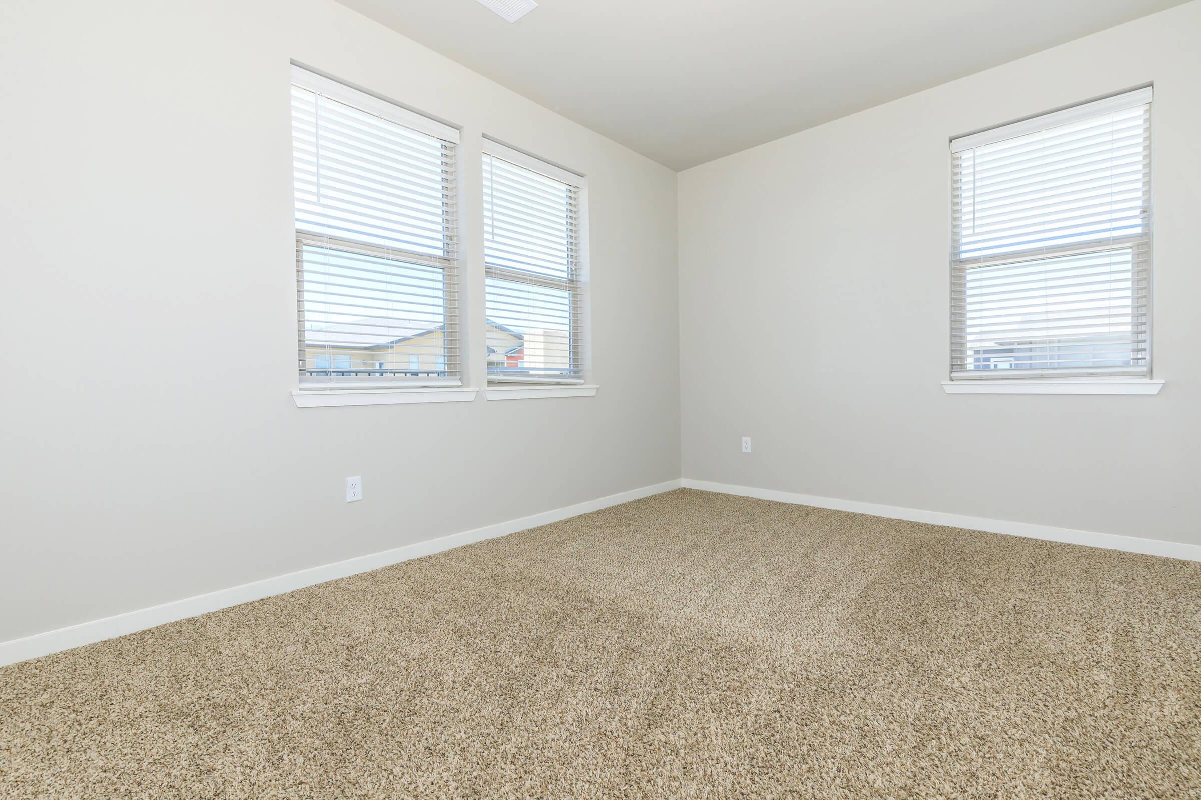 a bedroom with a large window