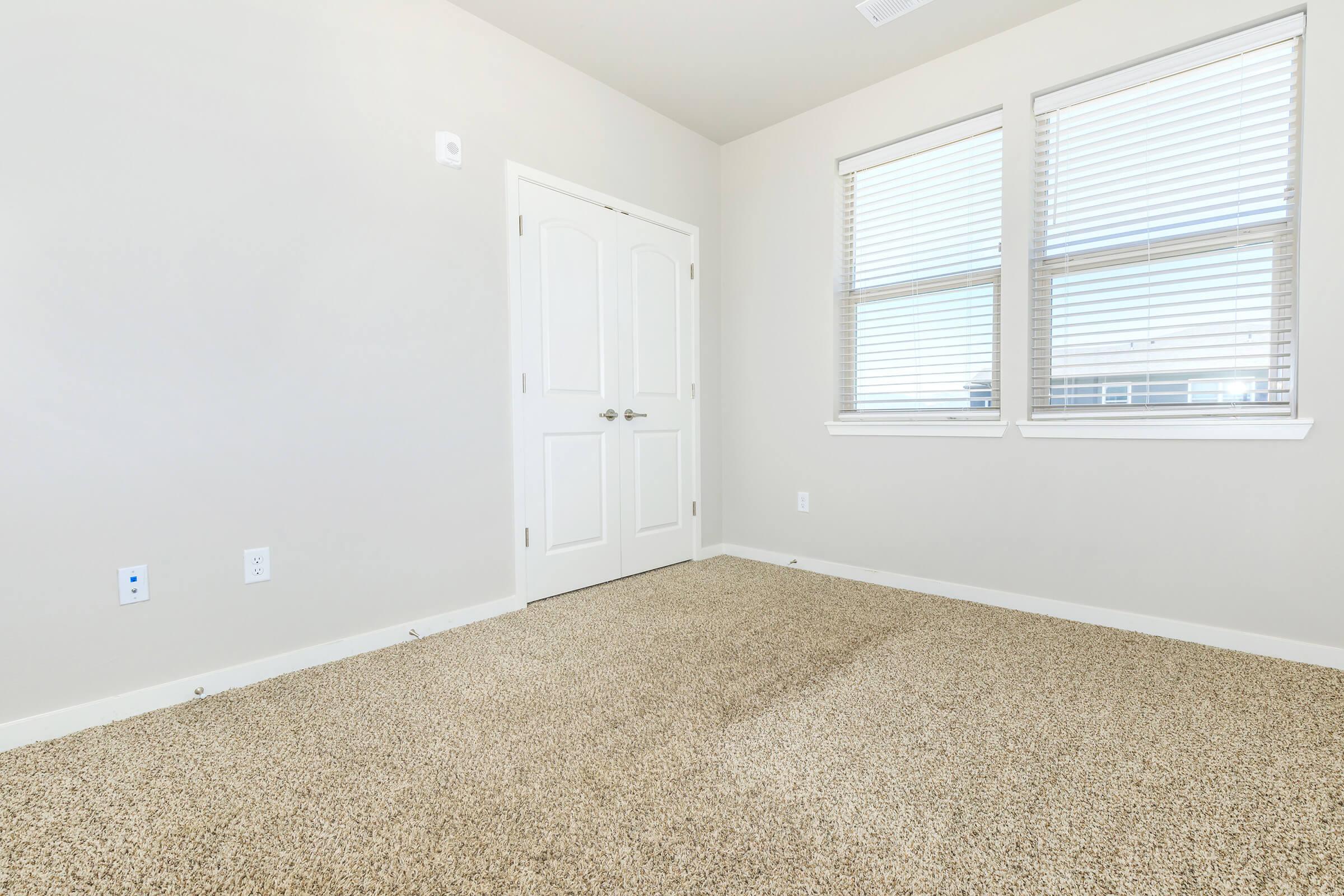 a bedroom with a large window