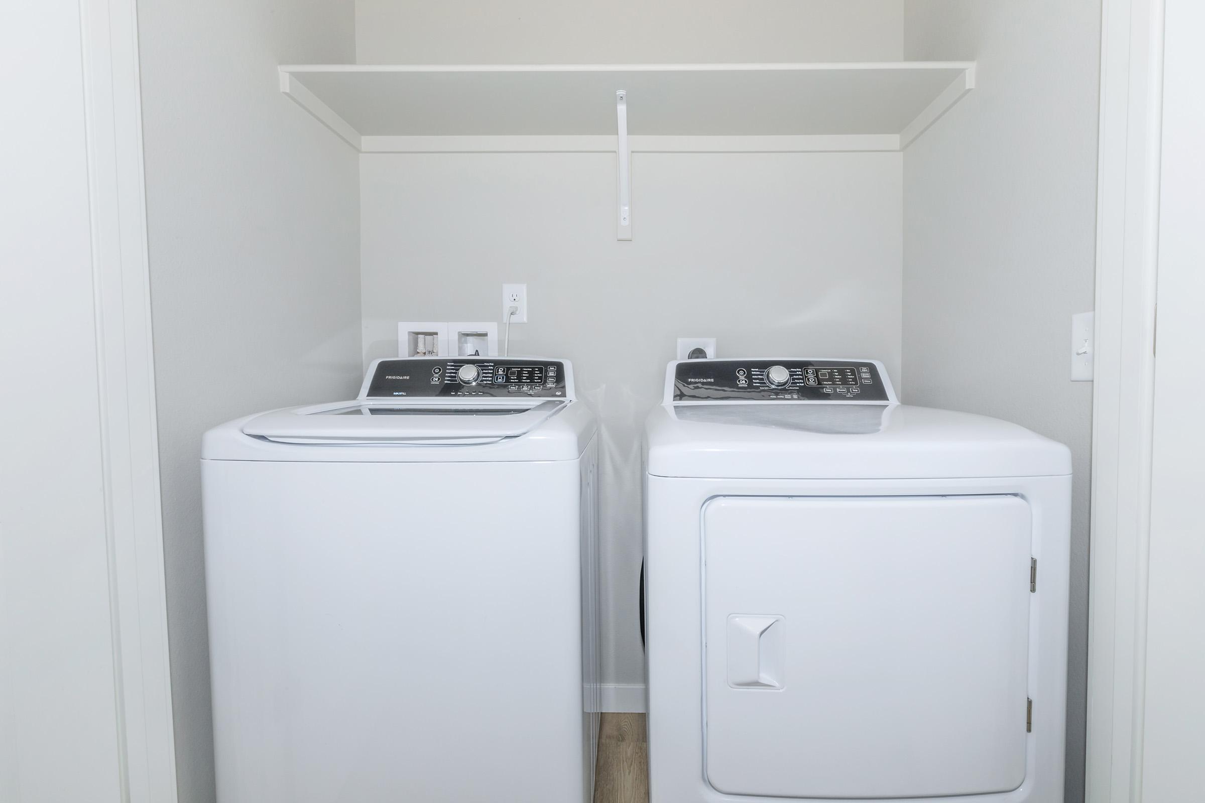 a microwave oven sitting on top of a refrigerator