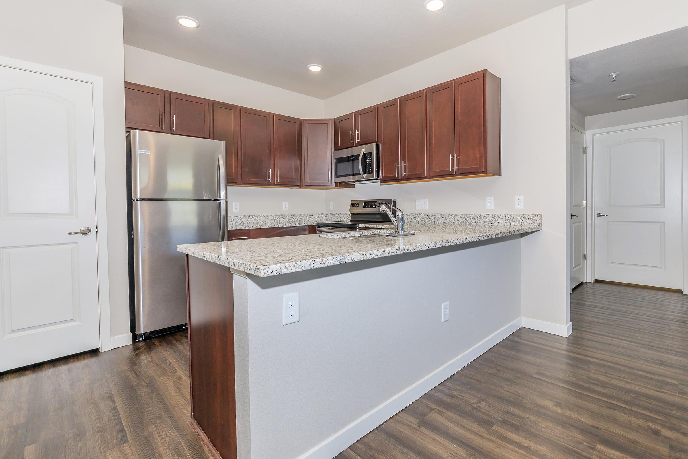 a kitchen with a wood floor