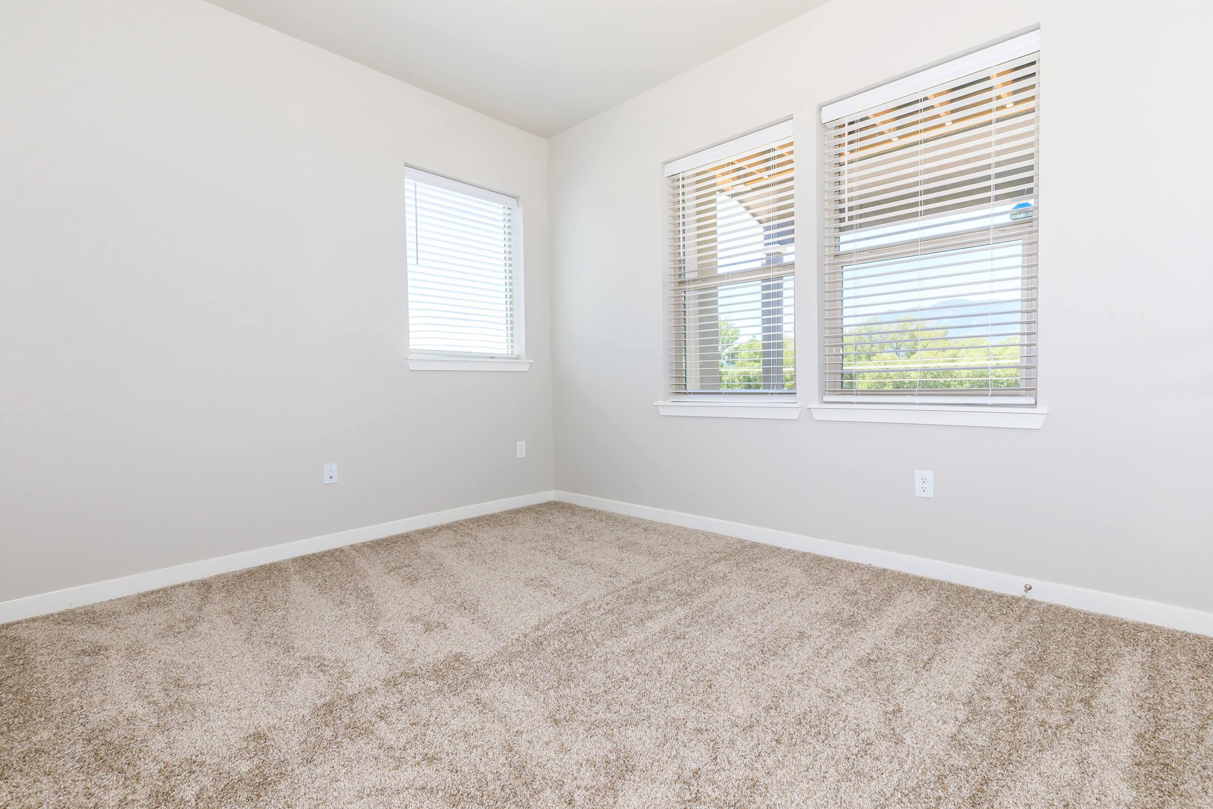 a bedroom with a large window