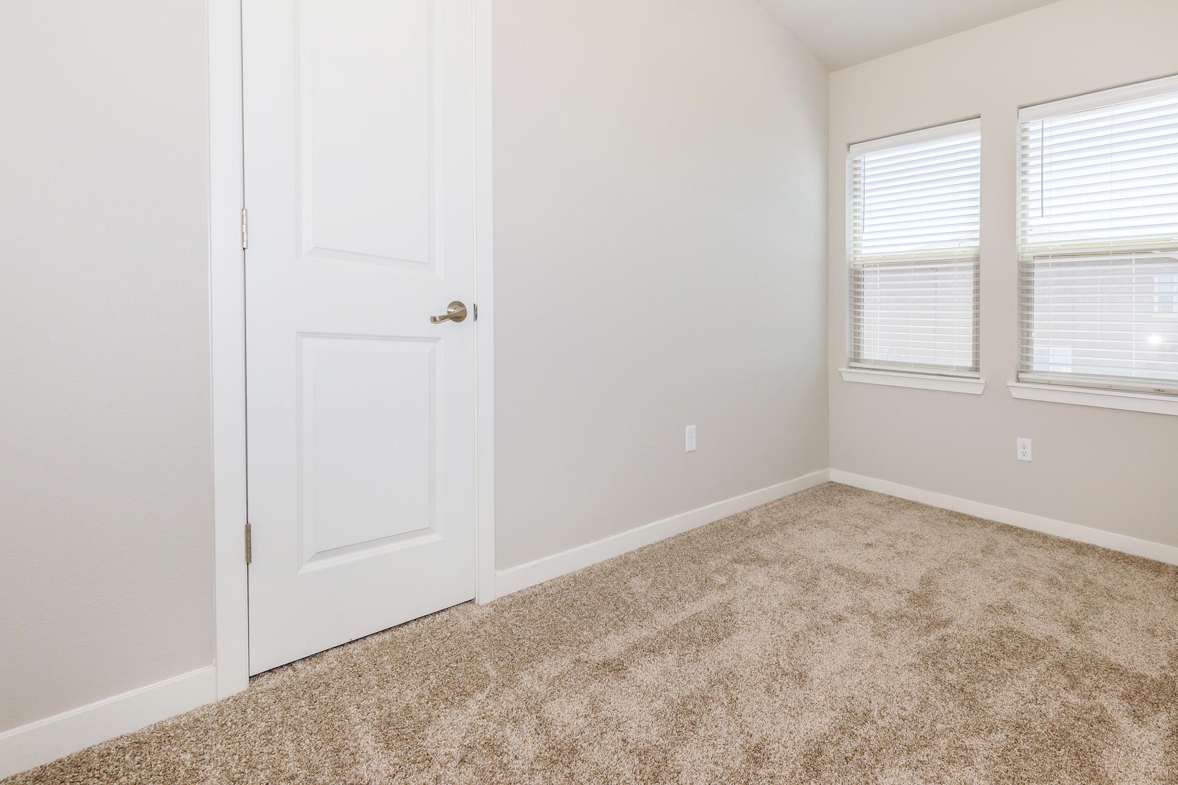 a bedroom with a large window