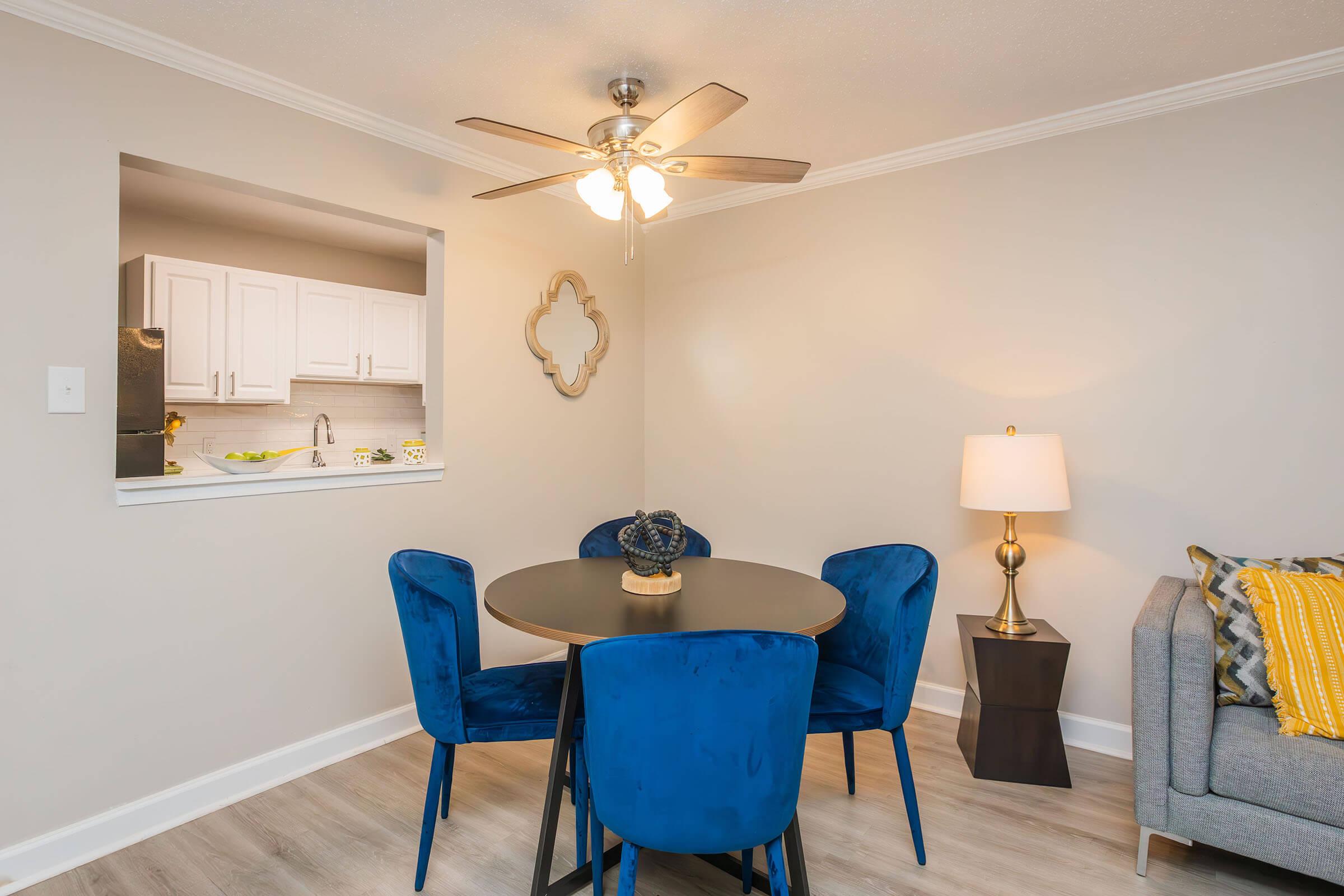 a living room with a blue chair