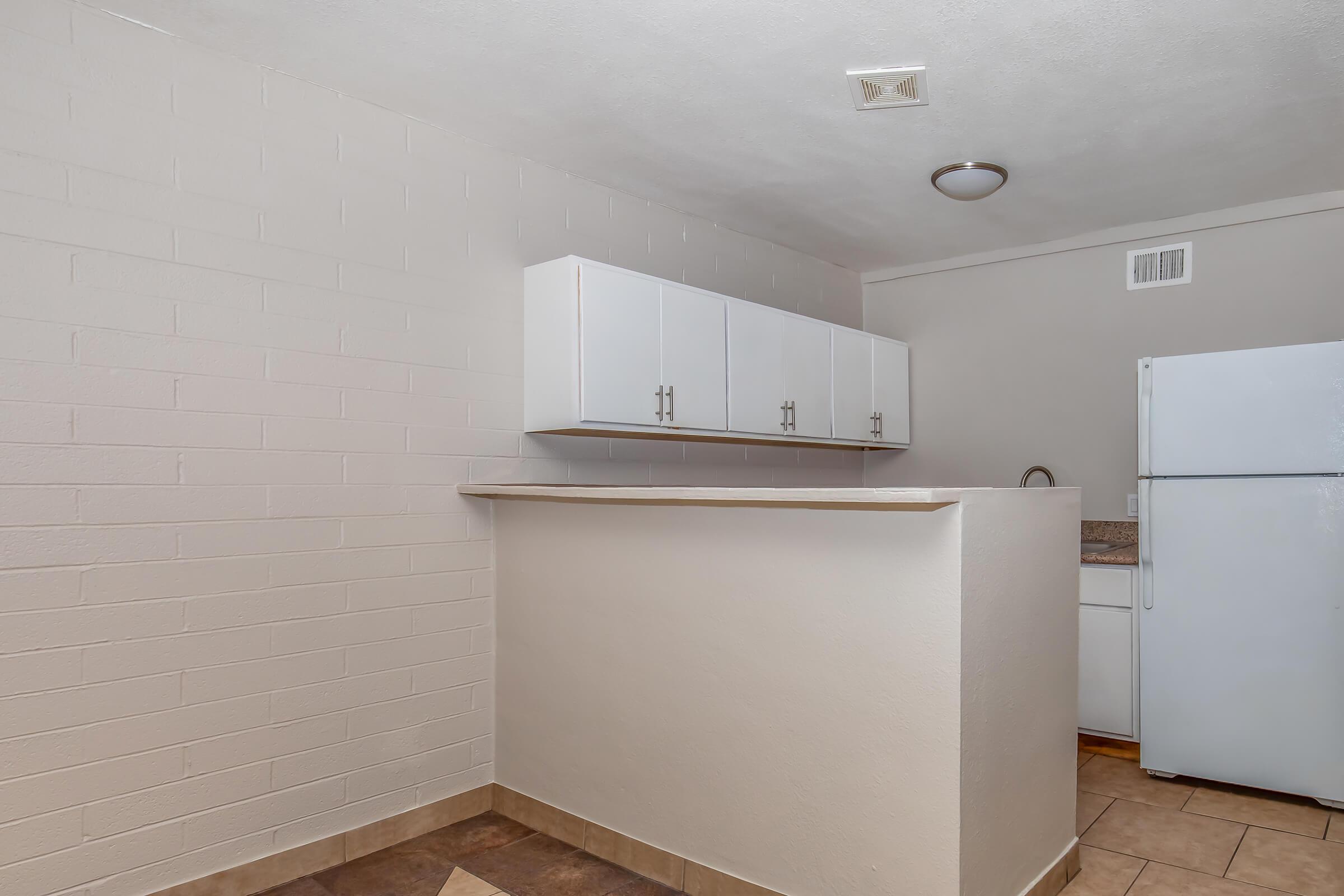 a kitchen with a tile floor